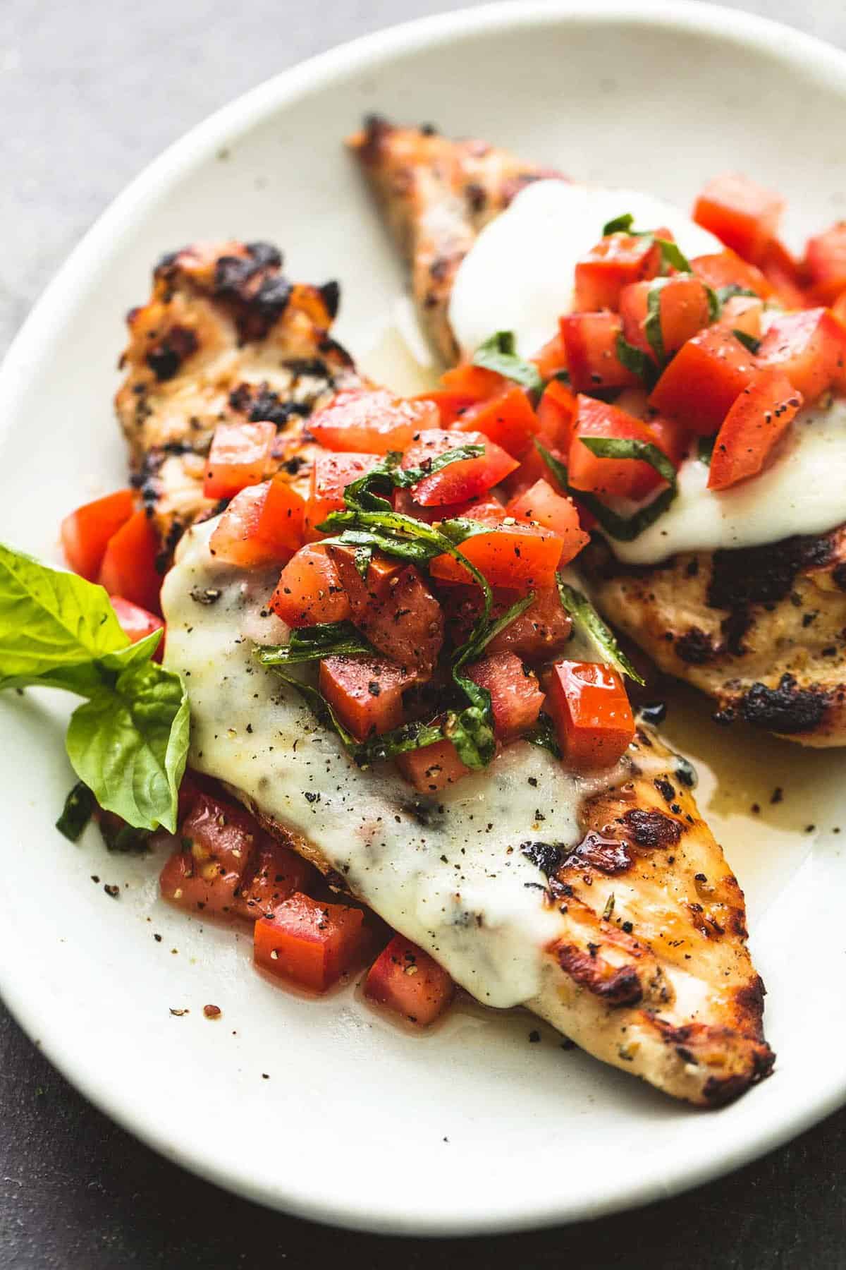 grilled bruschetta chicken on a plate.