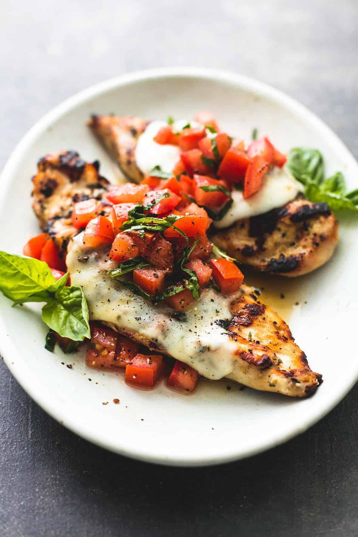 grilled bruschetta chicken on a plate.