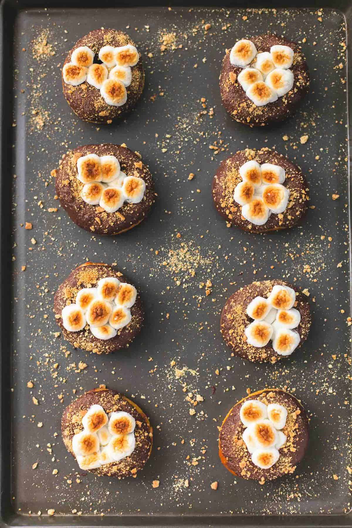 top view of s'mores donuts on a baking sheet.