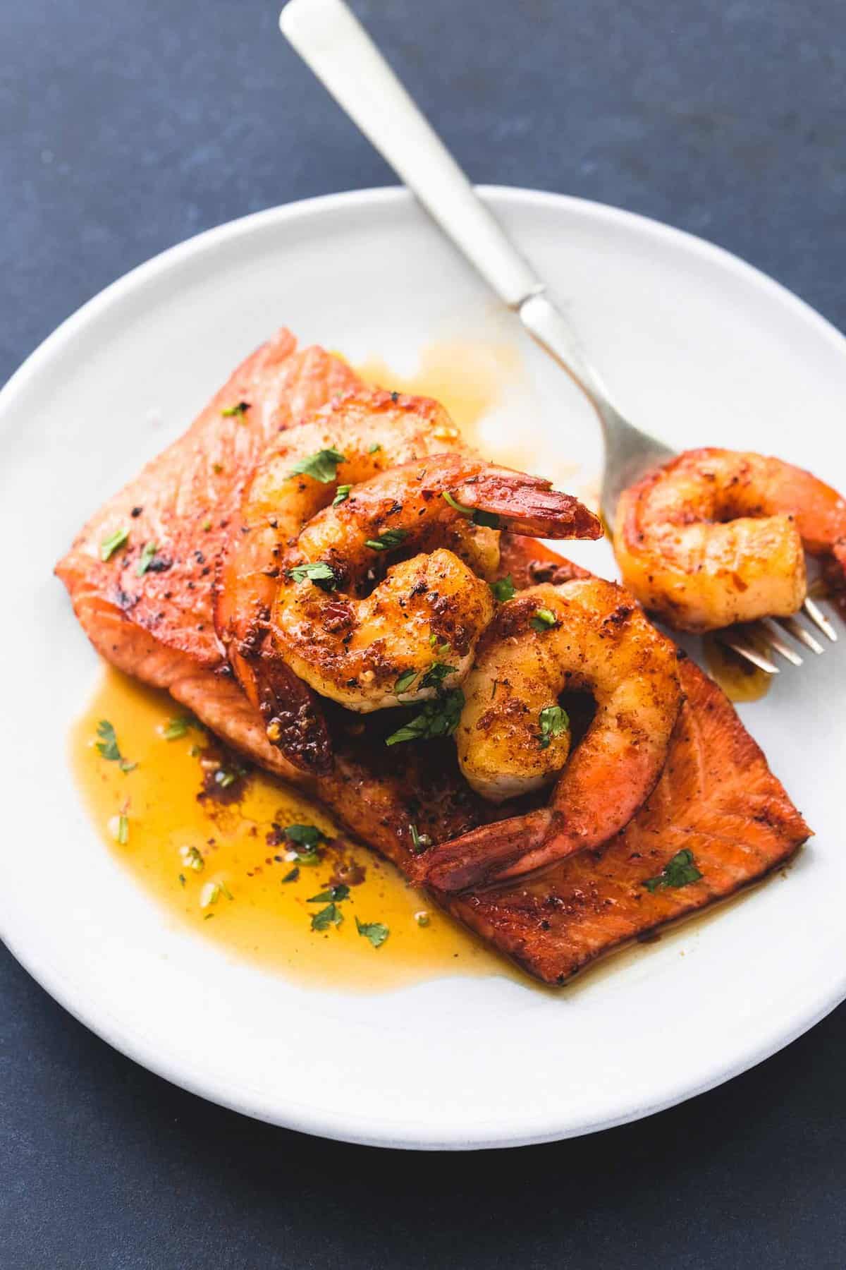 salmon New Orleans with a fork on a plate.