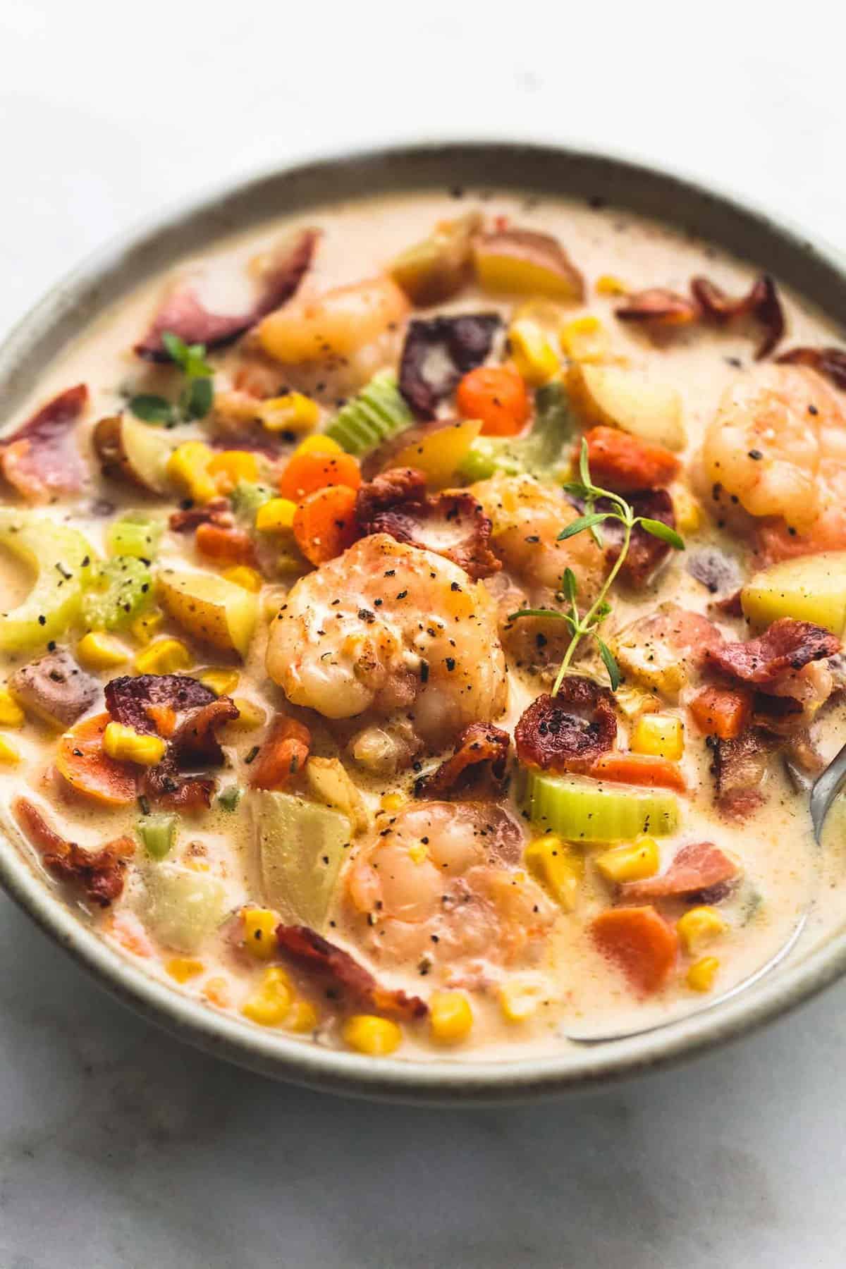 shrimp and bacon corn chowder in a bowl.
