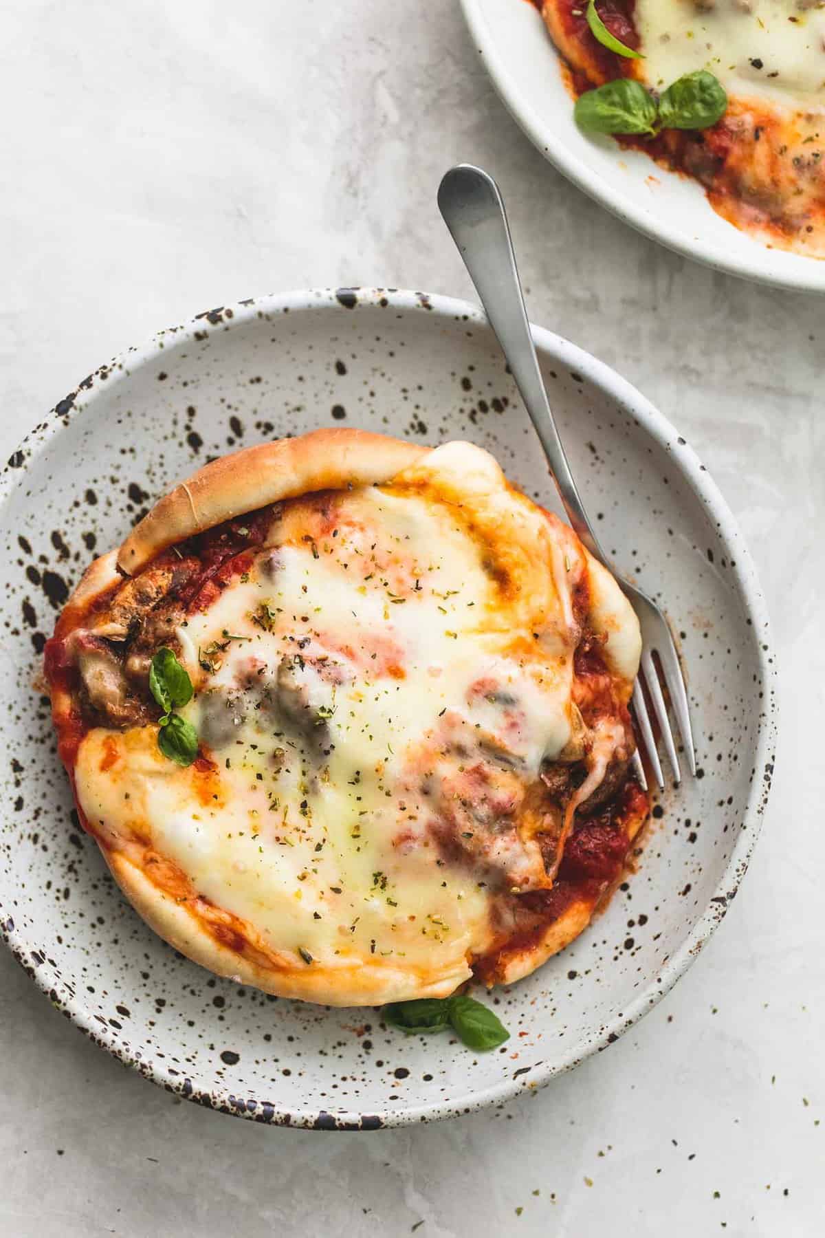 top view of pizza pot pie with a fork on a plate.