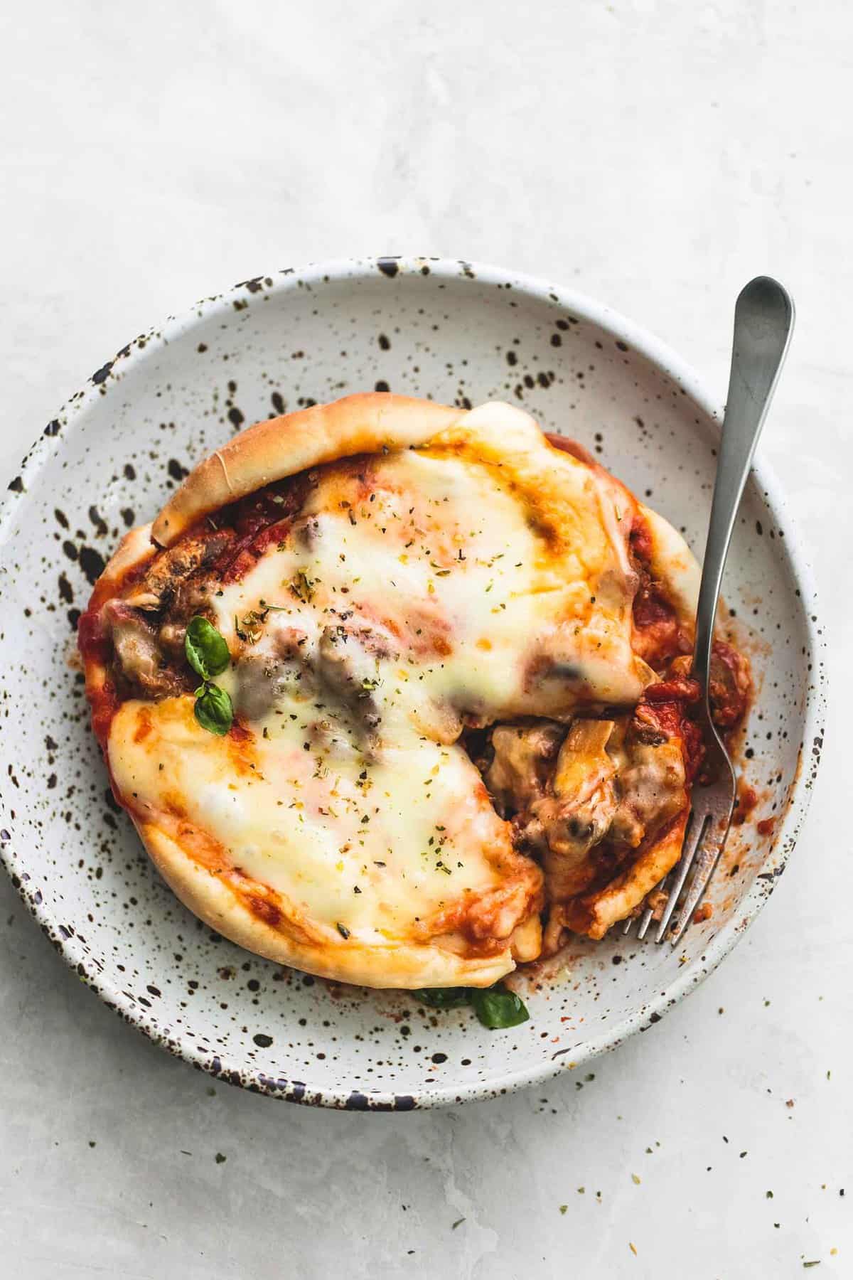 top view of pizza pot pie with a fork on a plate.