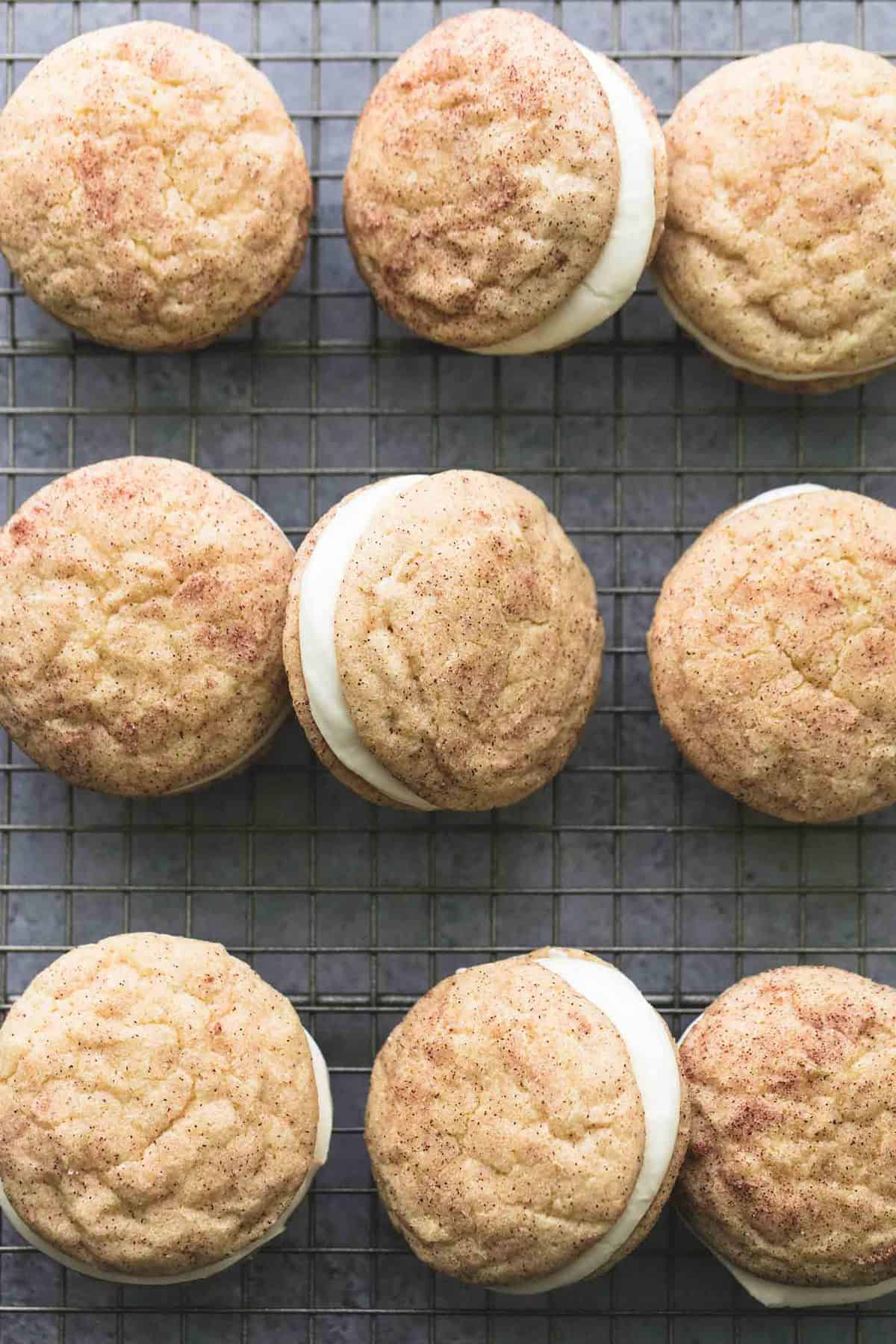top view of eggnog snickerdoodle whoopie pies on a cooling rack.