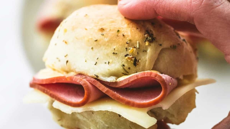 Ham and Cheese Sliders on Buttery Herb Rolls | lecremedelacrumb.com