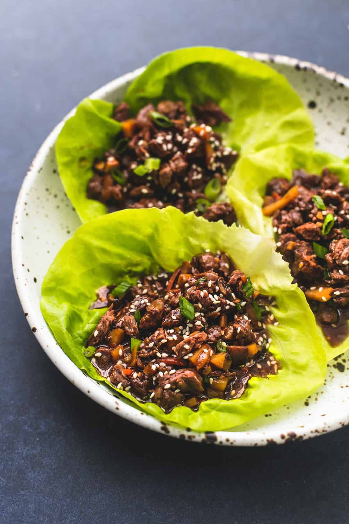 honey beef lettuce wraps on a plate.