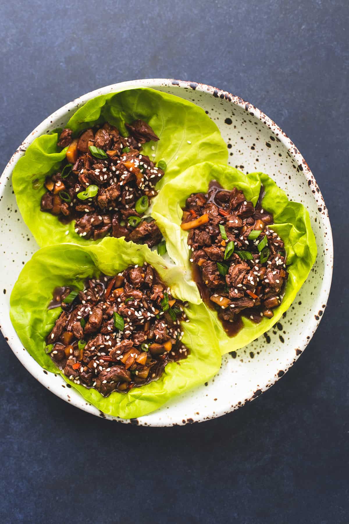 top view of honey beef lettuce wraps on a plate.
