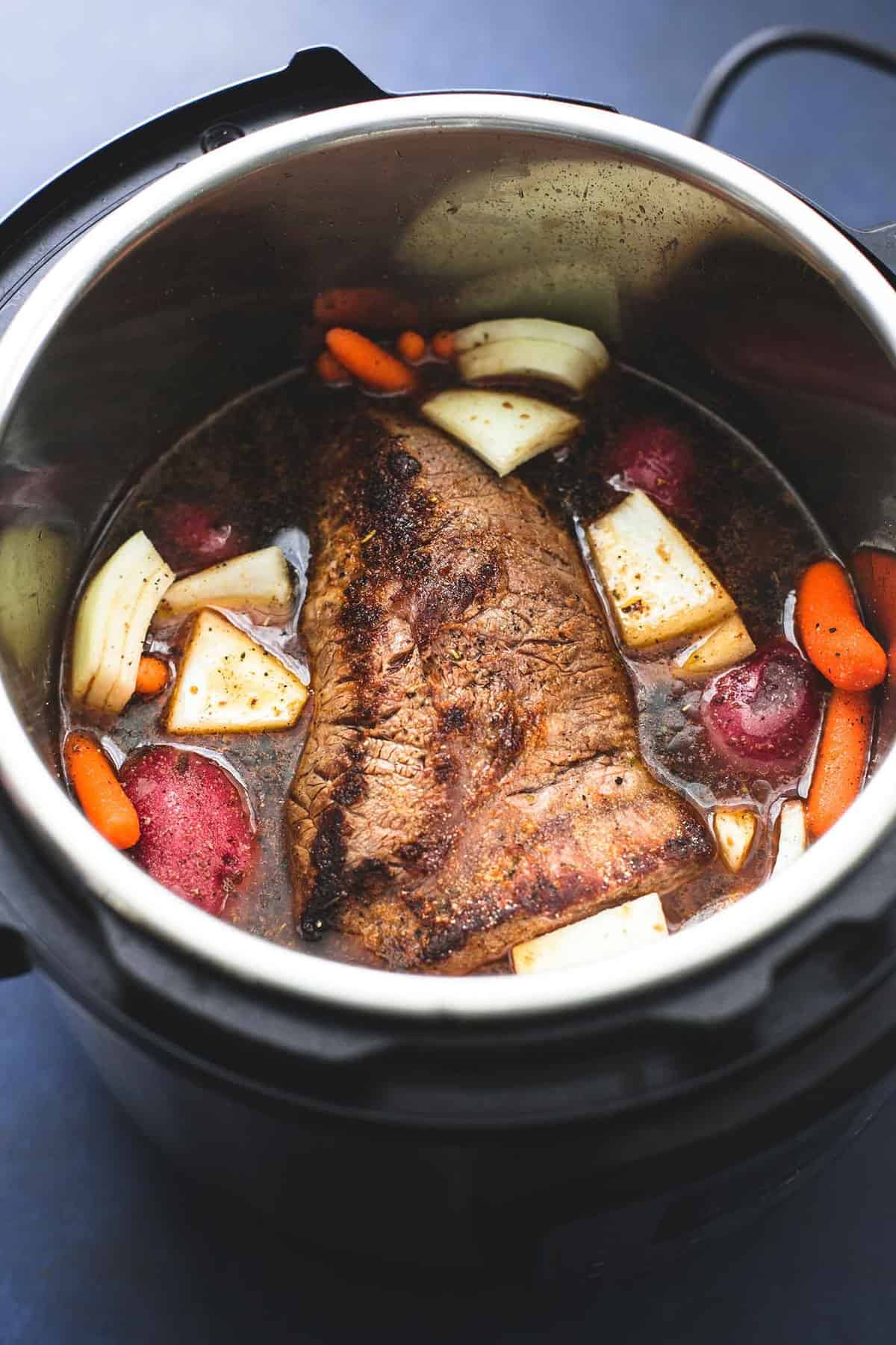 instant pot pot roast and potatoes in a instant pot.