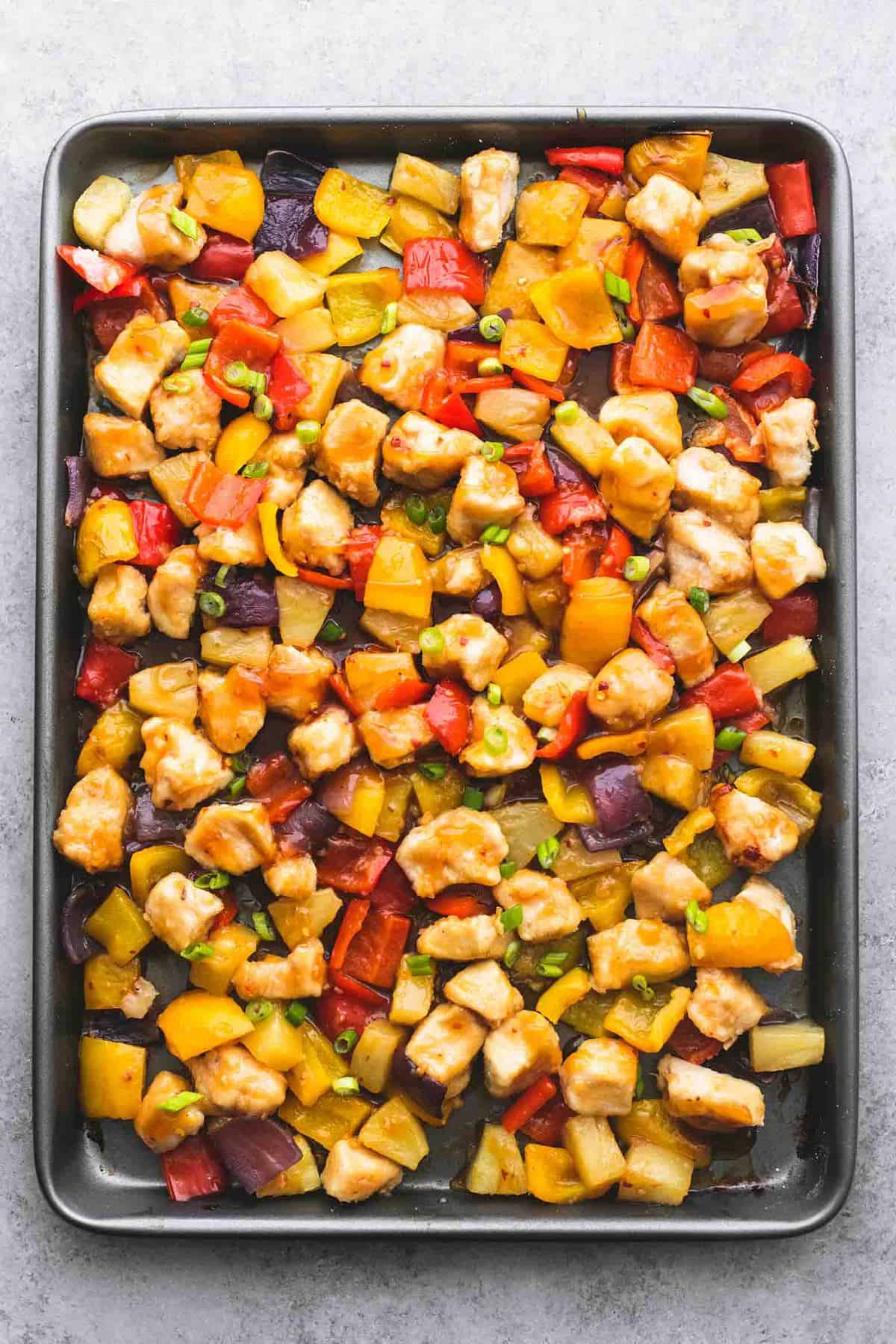 top view of sheet pan sweet fire chicken on a baking sheet.