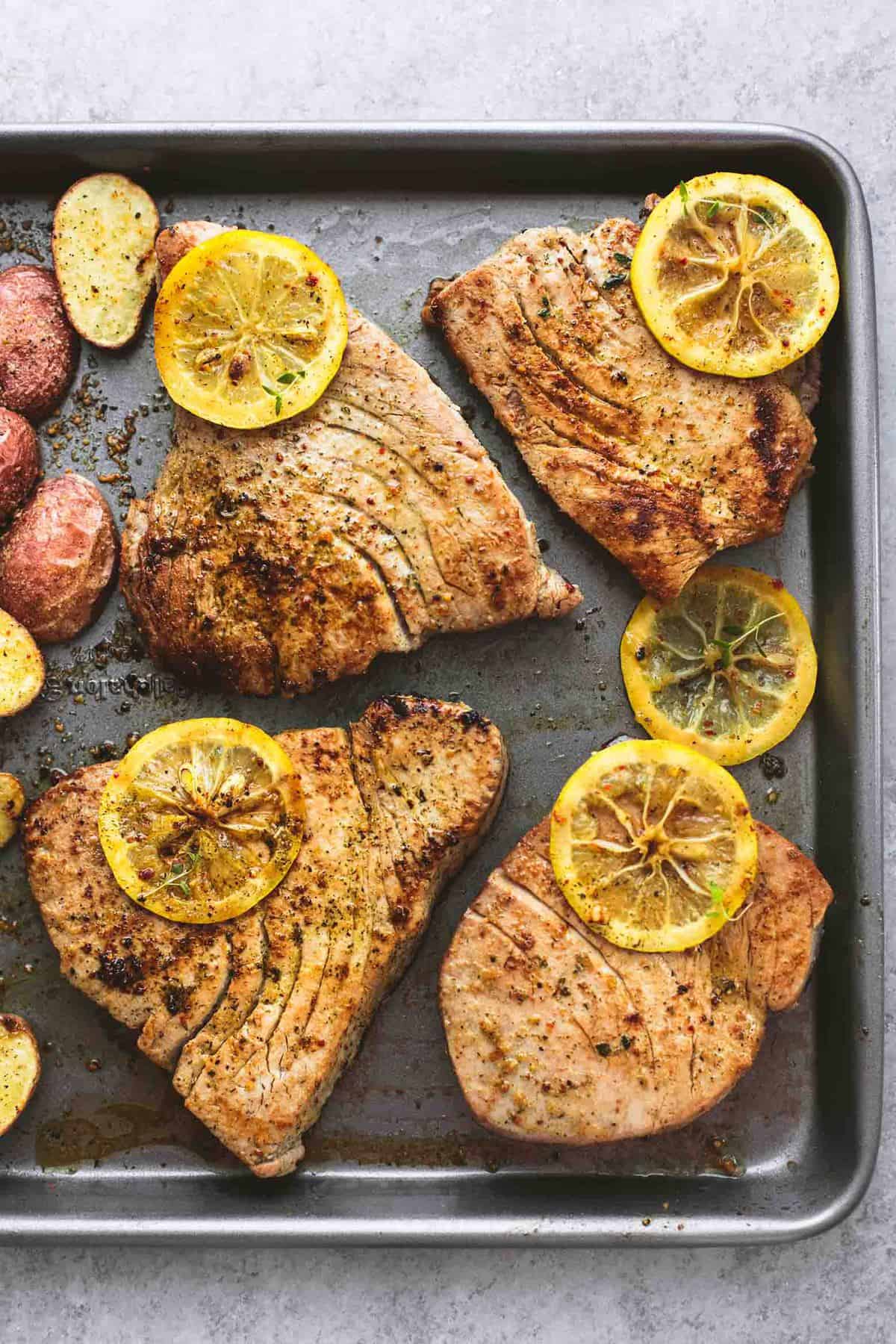 Sheet Pan Lemon Herb Tuna Steaks and Potatoes | lecremedelacrumb.com