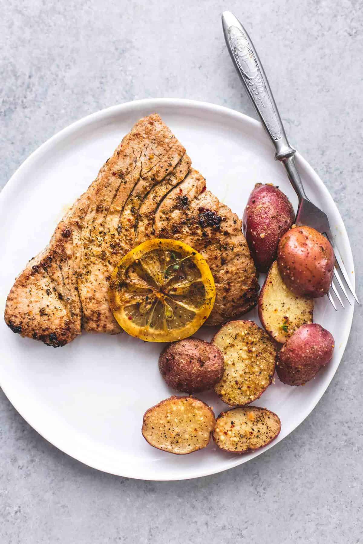 Sheet Pan Lemon Herb Tuna Steaks and Potatoes | lecremedelacrumb.com