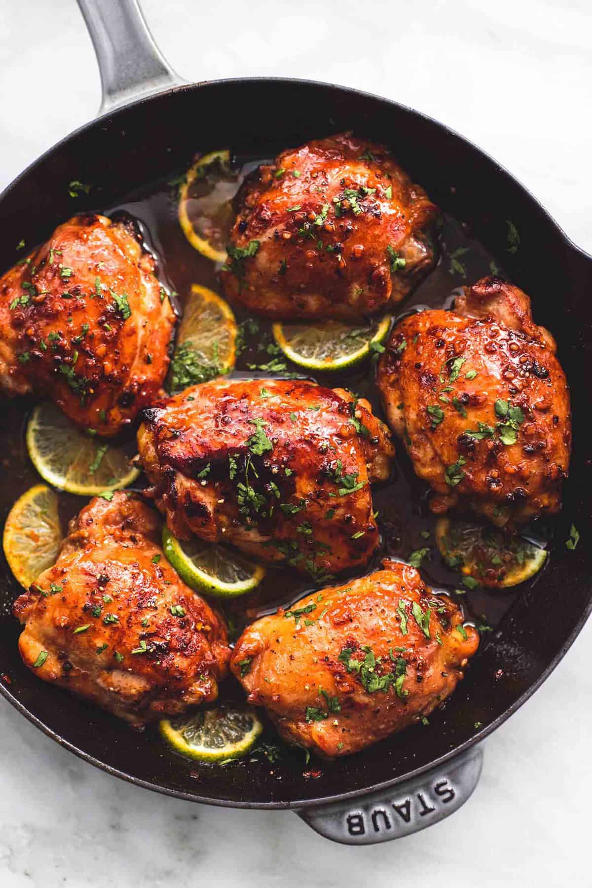 top view of honey lime garlic chicken in a pan.