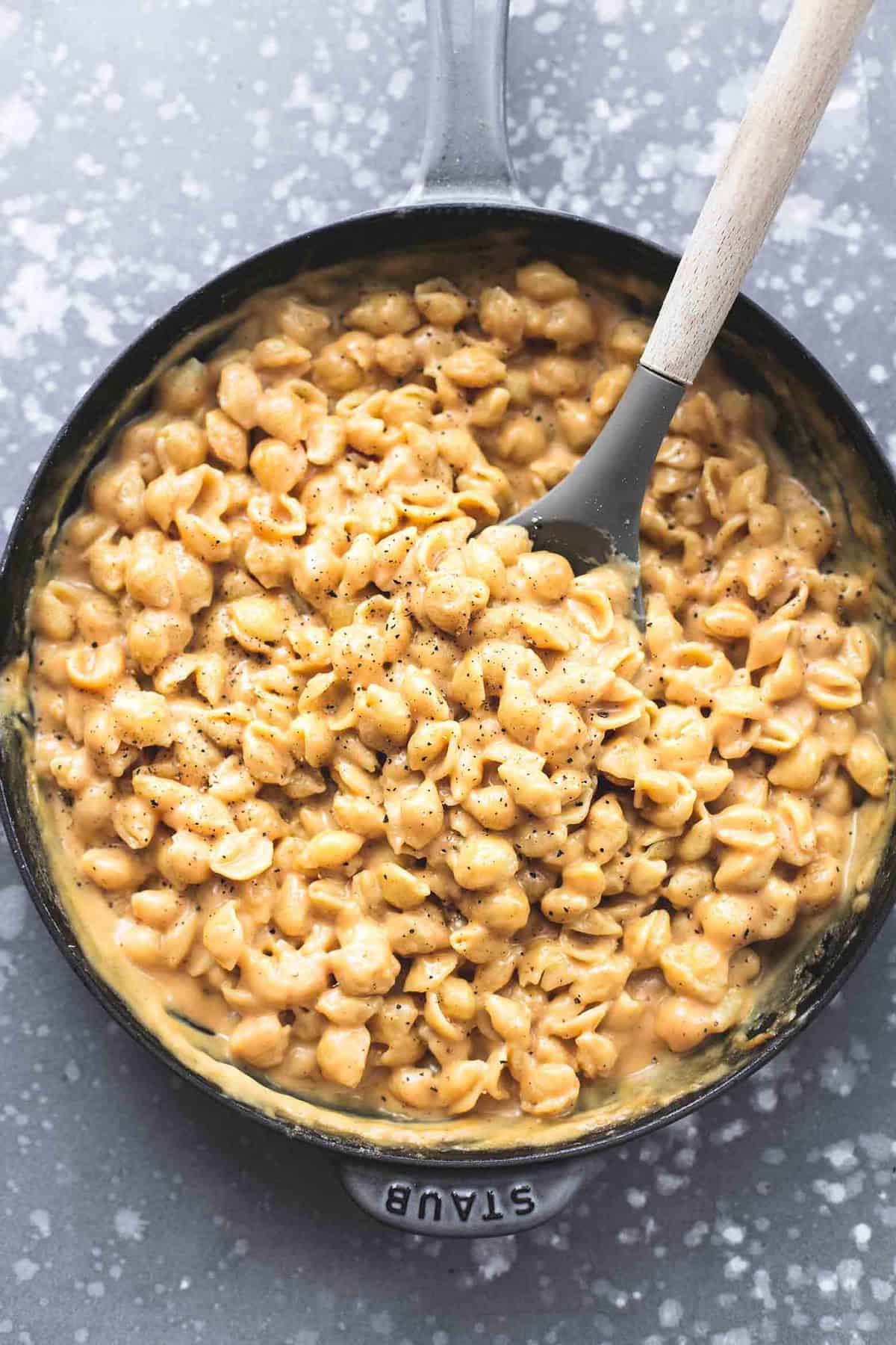 top view of simple macaroni and cheese with a serving spoon in a pan.