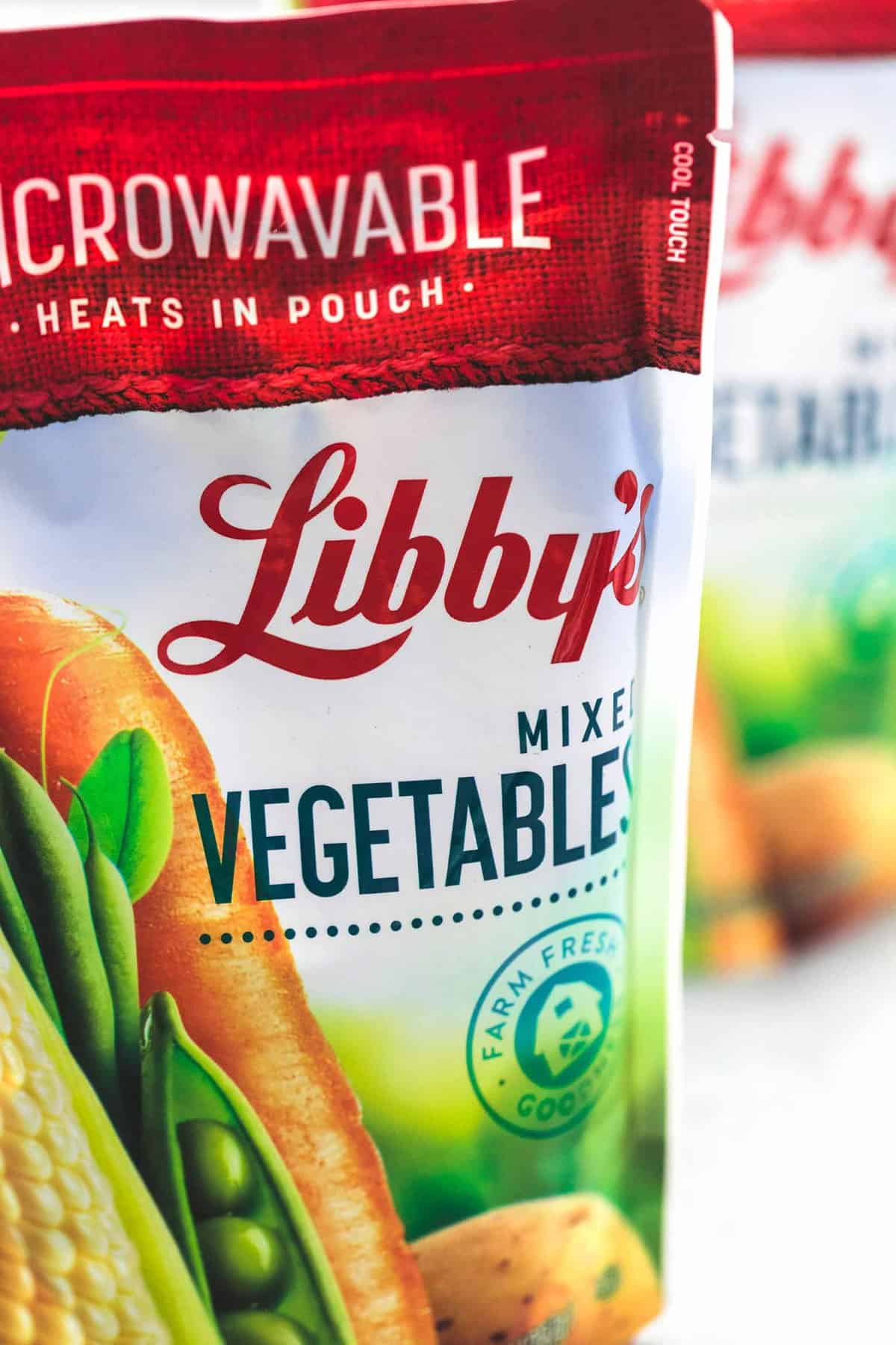 close up of a package of Libby's mixed vegetables with another package faded in the background.