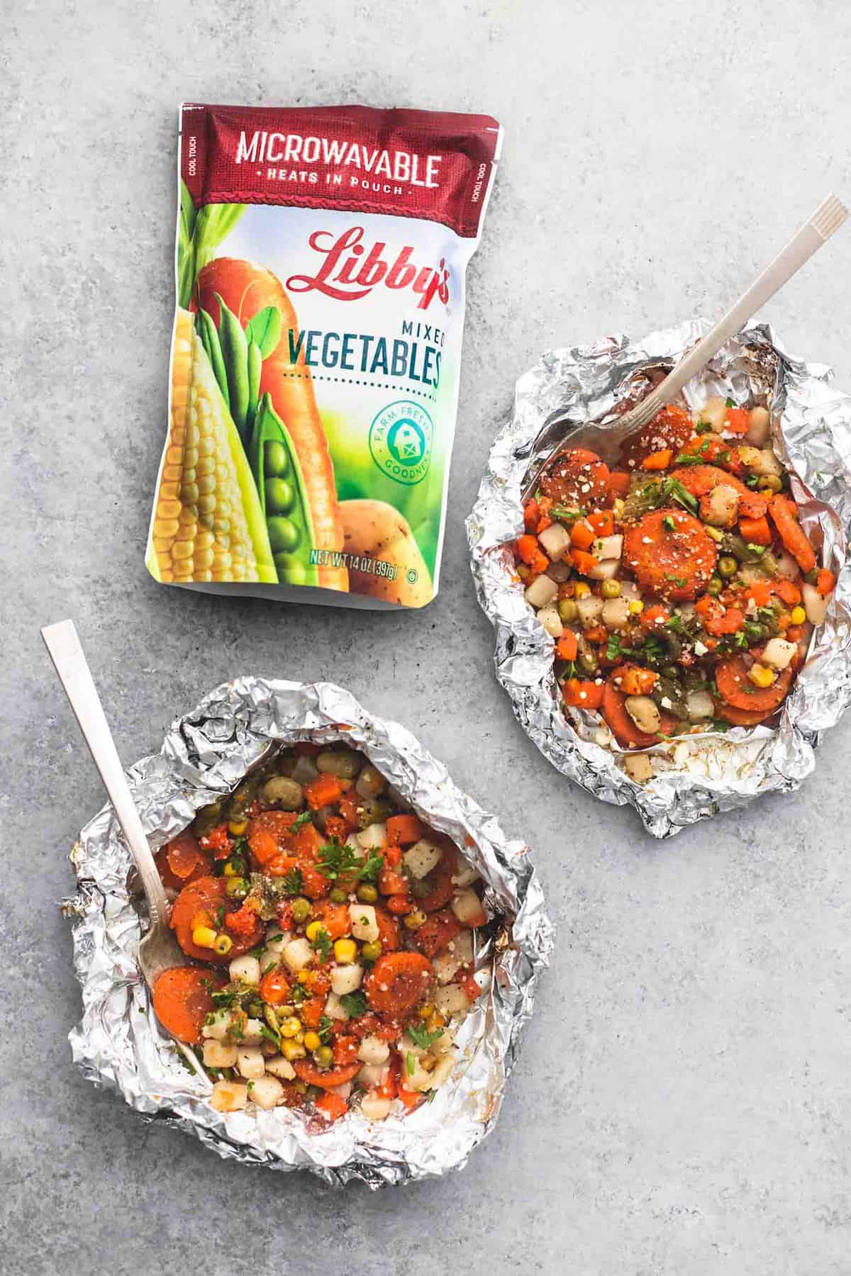 top view of vegetable medley foil packs with a package of Libby's mixed vegetables on the side.