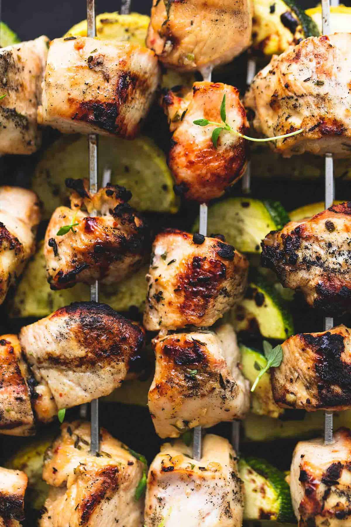 close up of zesty herb chicken and veggies skewers.