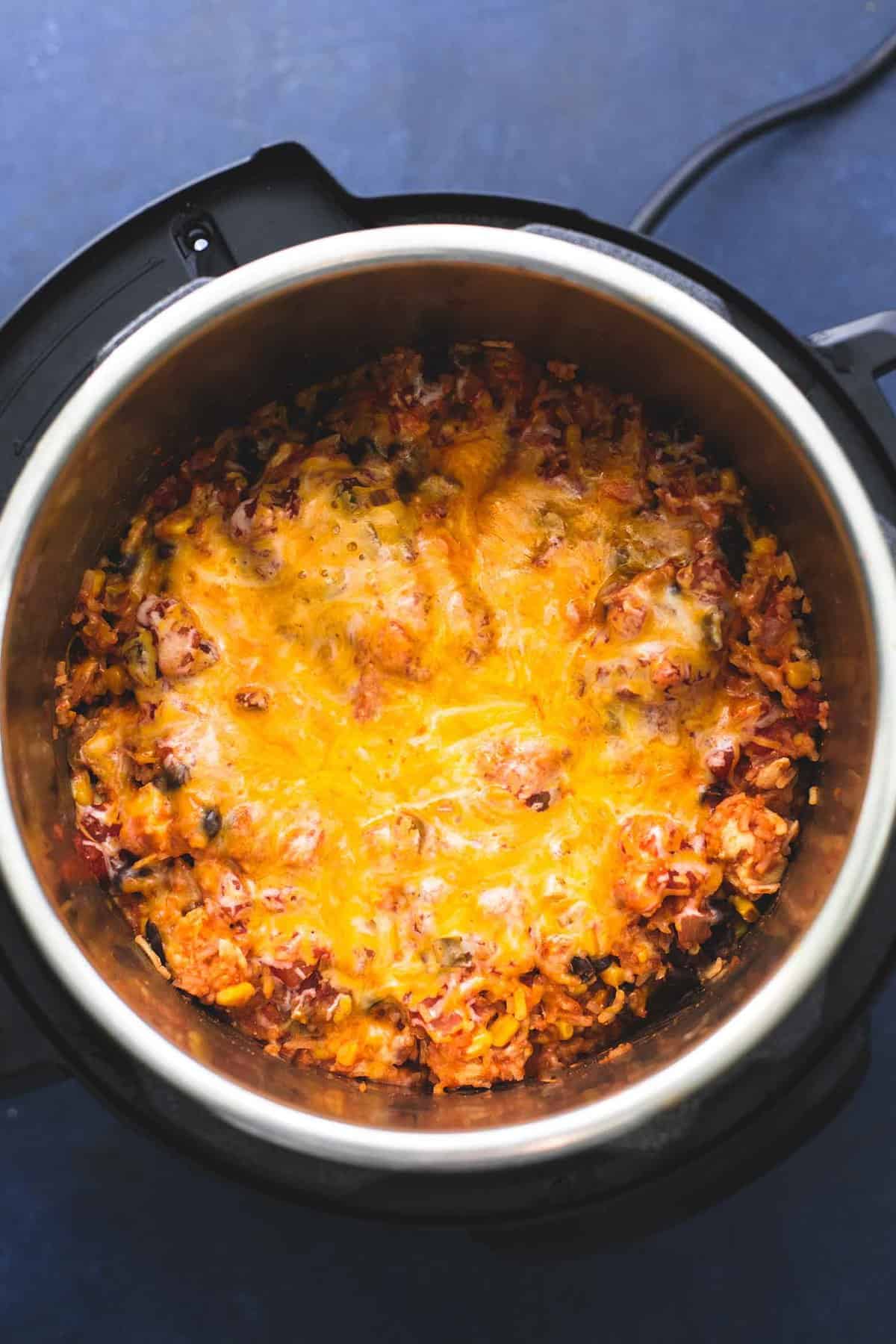 top view of instant pot cheesy Mexican chicken and rice in an instant pot.