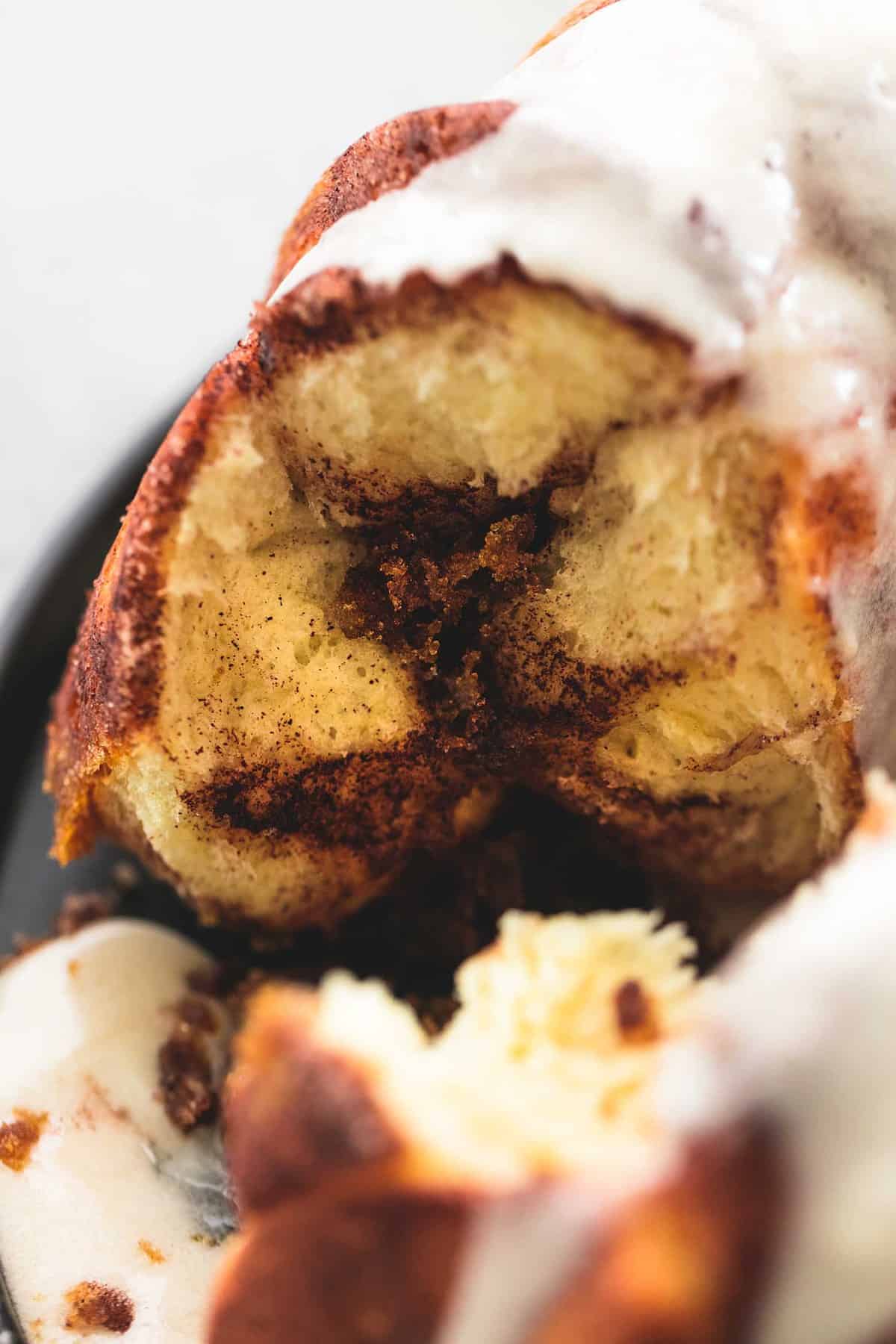 close up of cinnamon swirl monkey bread with a slice missing.