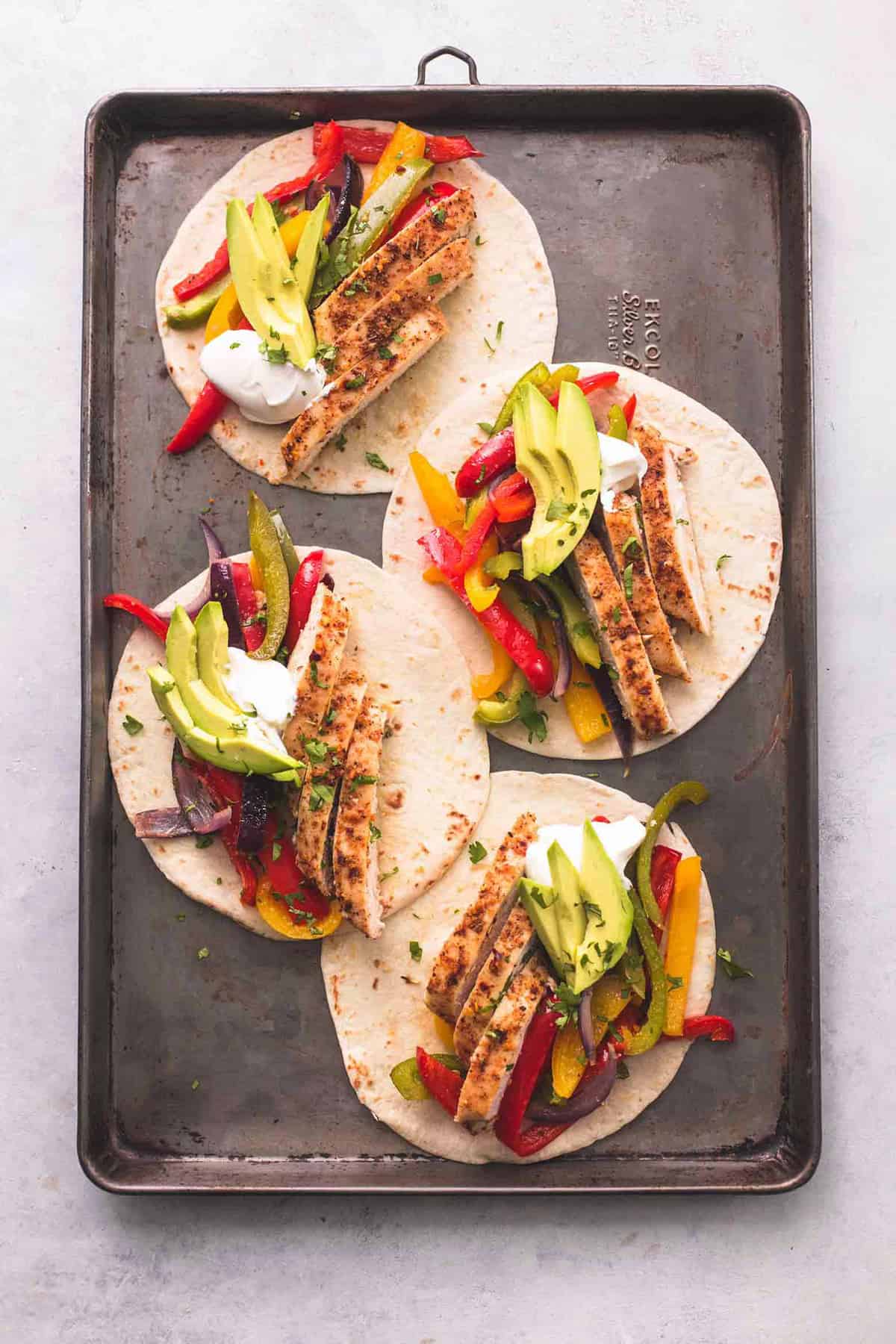 top view of sheet pan chicken fajitas on a sheet pan.