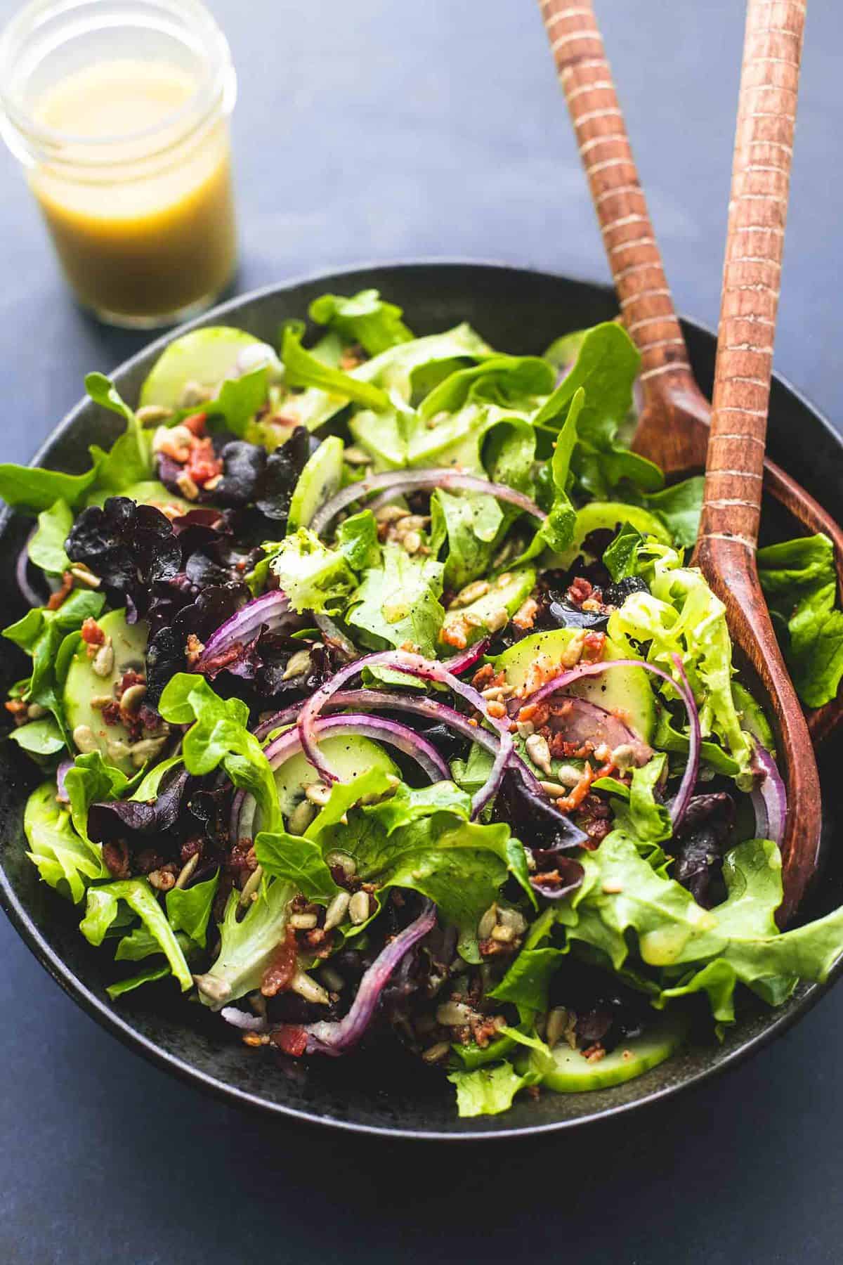 Best Simple Tossed Green Salad is the easiest side dish and goes perfectly with just about anything! Totally customizable and tossed in the tastiest 6-ingredient homemade dressing! | lecremedelacrumb.com