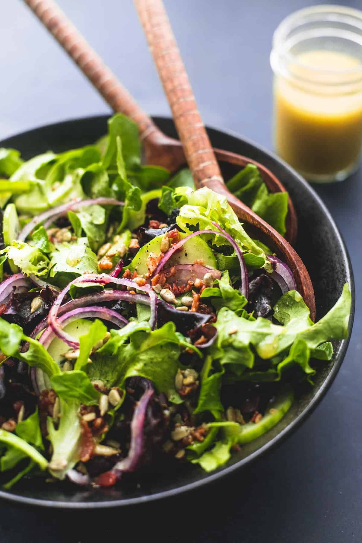 Best Simple Tossed Green Salad is the easiest side dish and goes perfectly with just about anything! Totally customizable and tossed in the tastiest 6-ingredient homemade dressing! | lecremedelacrumb.com