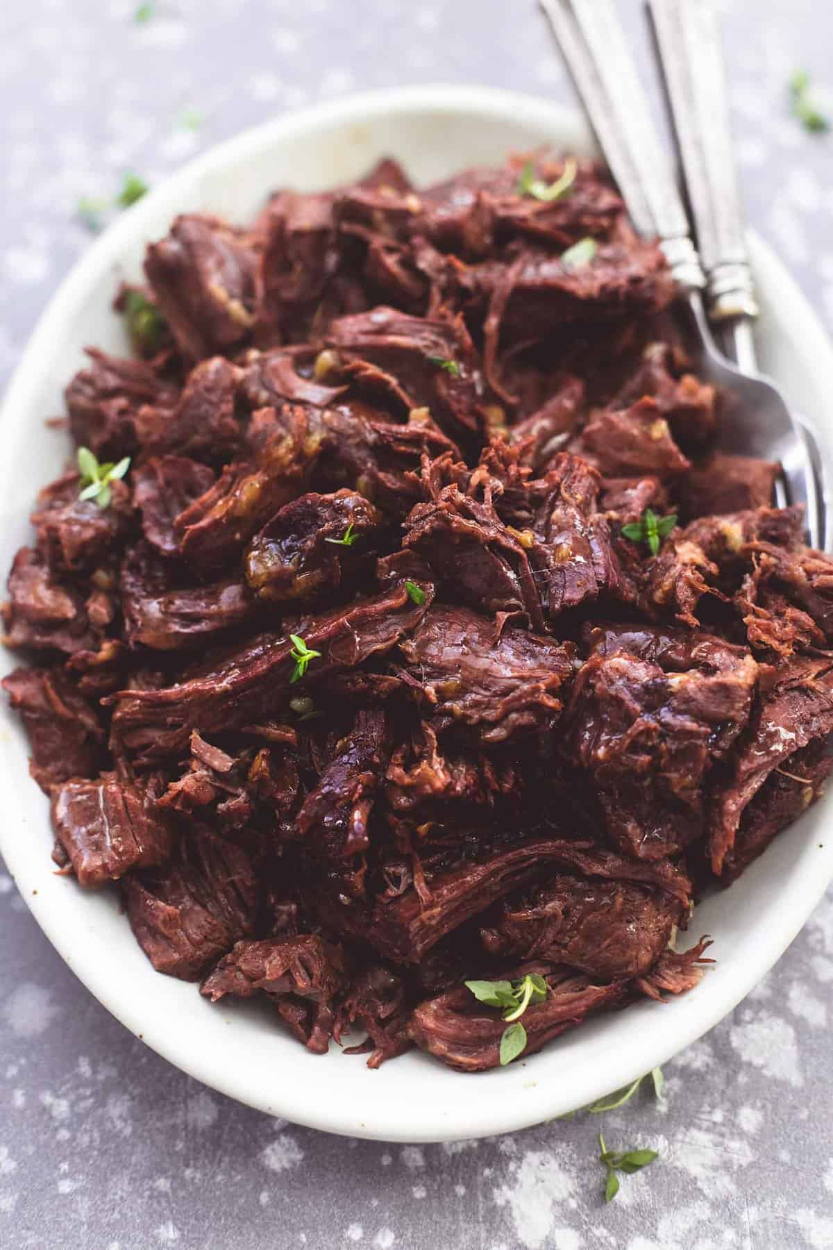 close up of instant pot potroaet with forks on a plate.