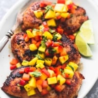 Easy, healthy and flavorful with just a few simple ingredients, this Mango Salsa Chicken will be your go-to for busy nights! | lecremedelacrumb.com