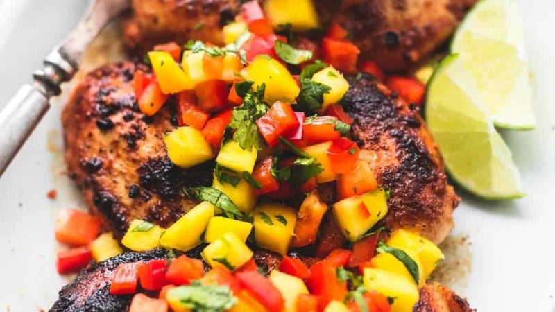 Easy, healthy and flavorful with just a few simple ingredients, this Mango Salsa Chicken will be your go-to for busy nights! | lecremedelacrumb.com