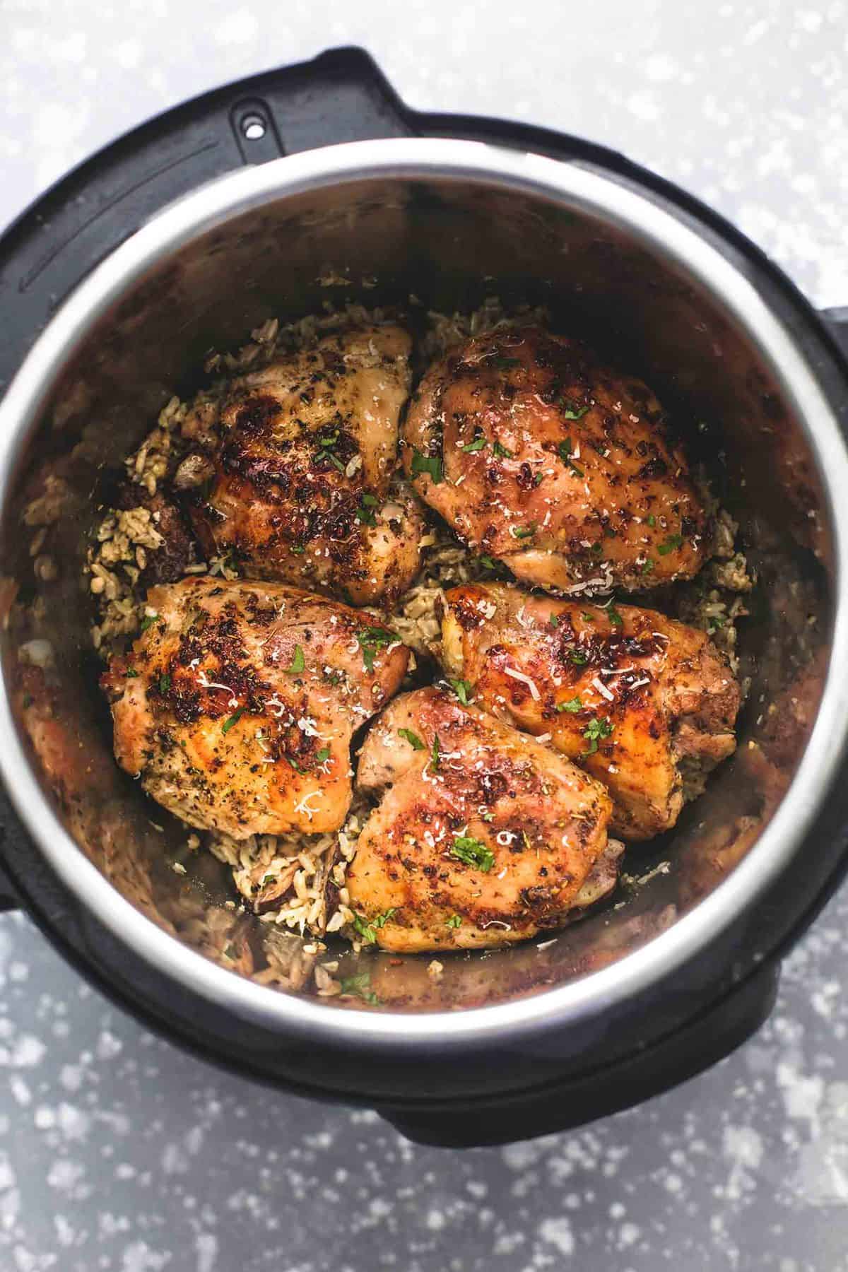 top view of instant pot parmesan chicken and mushroom rice in an instant pot.