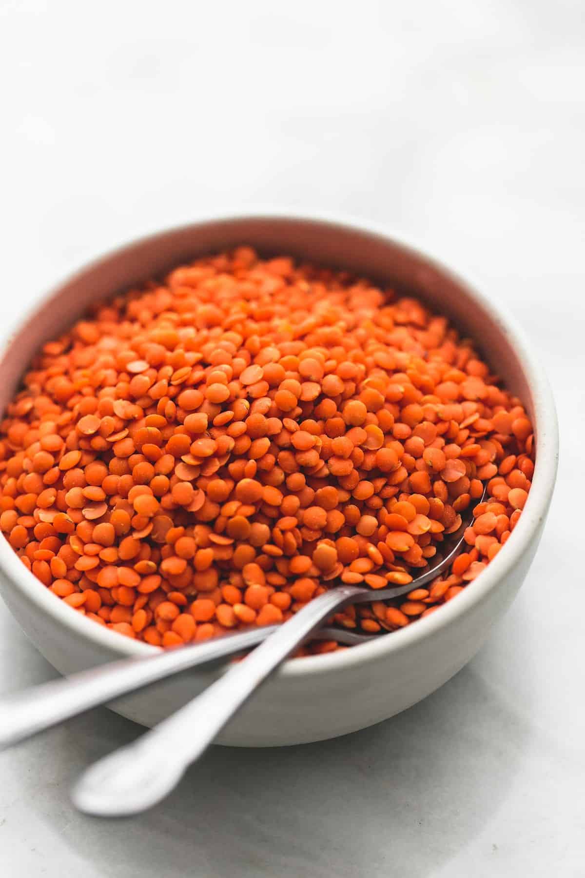 lentils and spoons in a bowl.