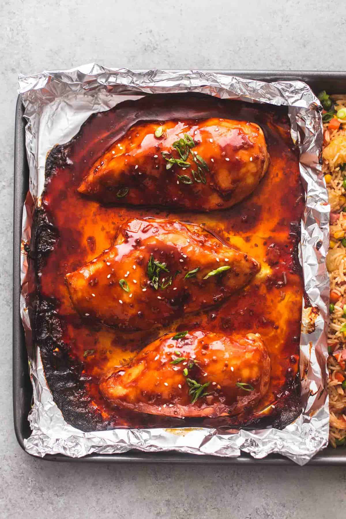 close up top view of teriyaki chicken in a sheet pan.