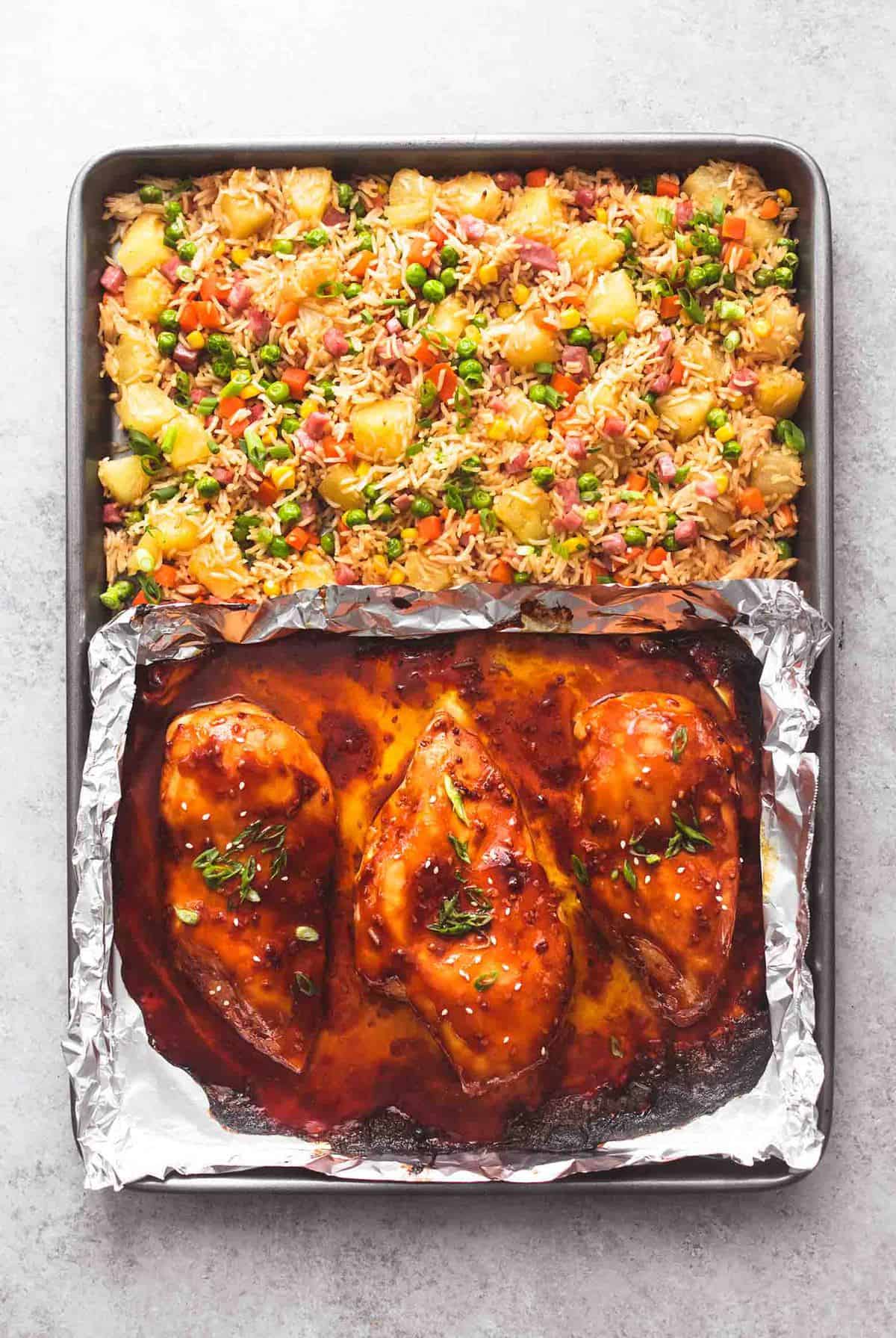 top view of sheet pan teriyaki chicken and pineapple fried rice on a sheet pan.