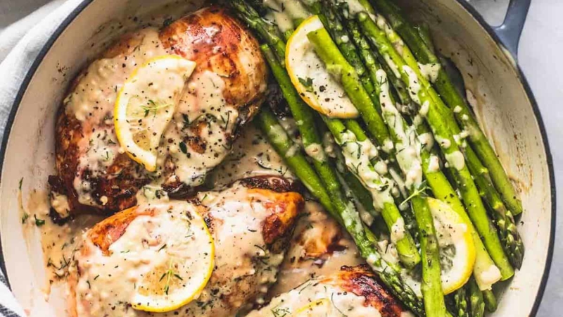 Easy One Pan Creamy Lemon Chicken and Asparagus Dinner Recipe | lecremedelacrumb.com