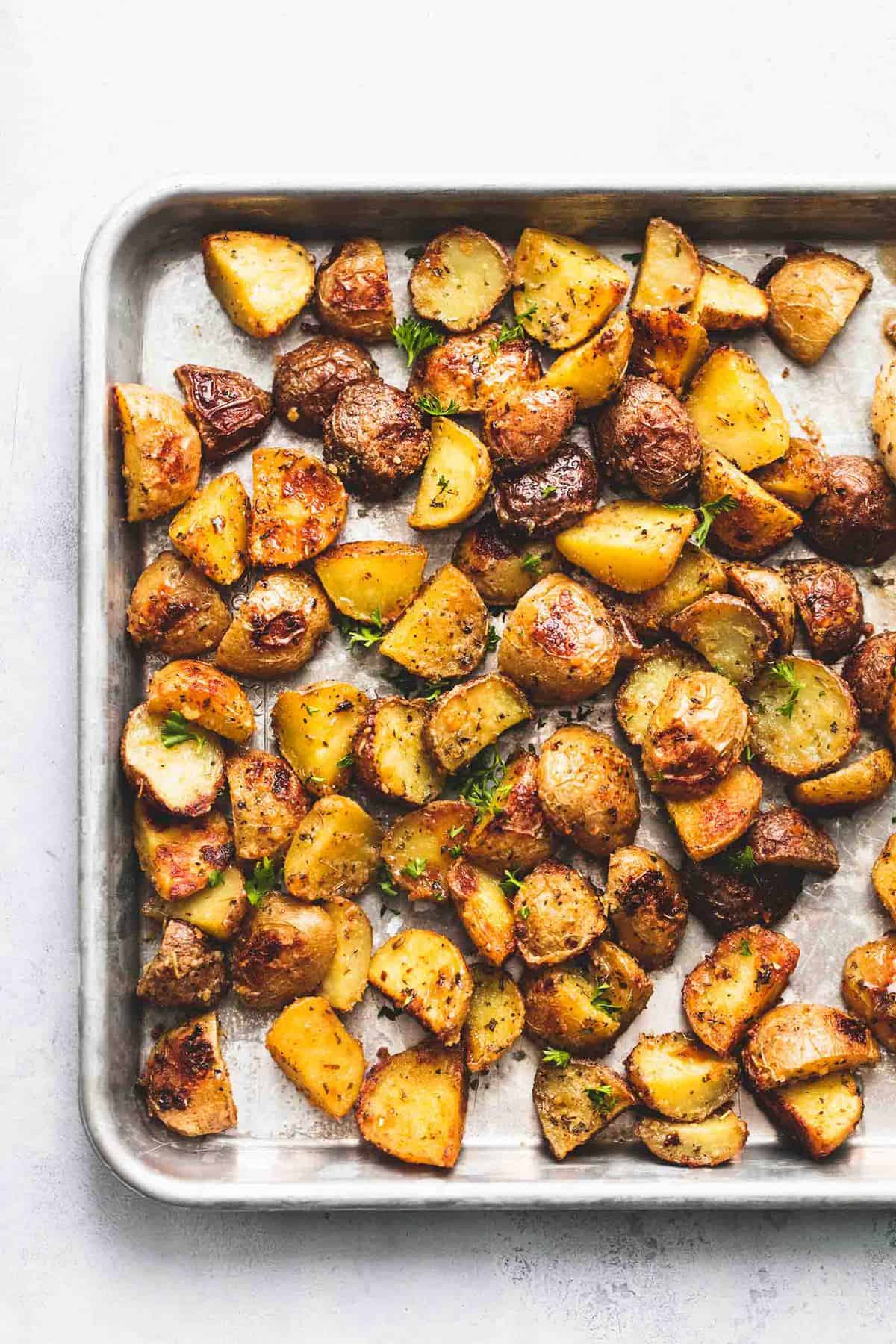 close up top view of potatoes on a sheet pan.