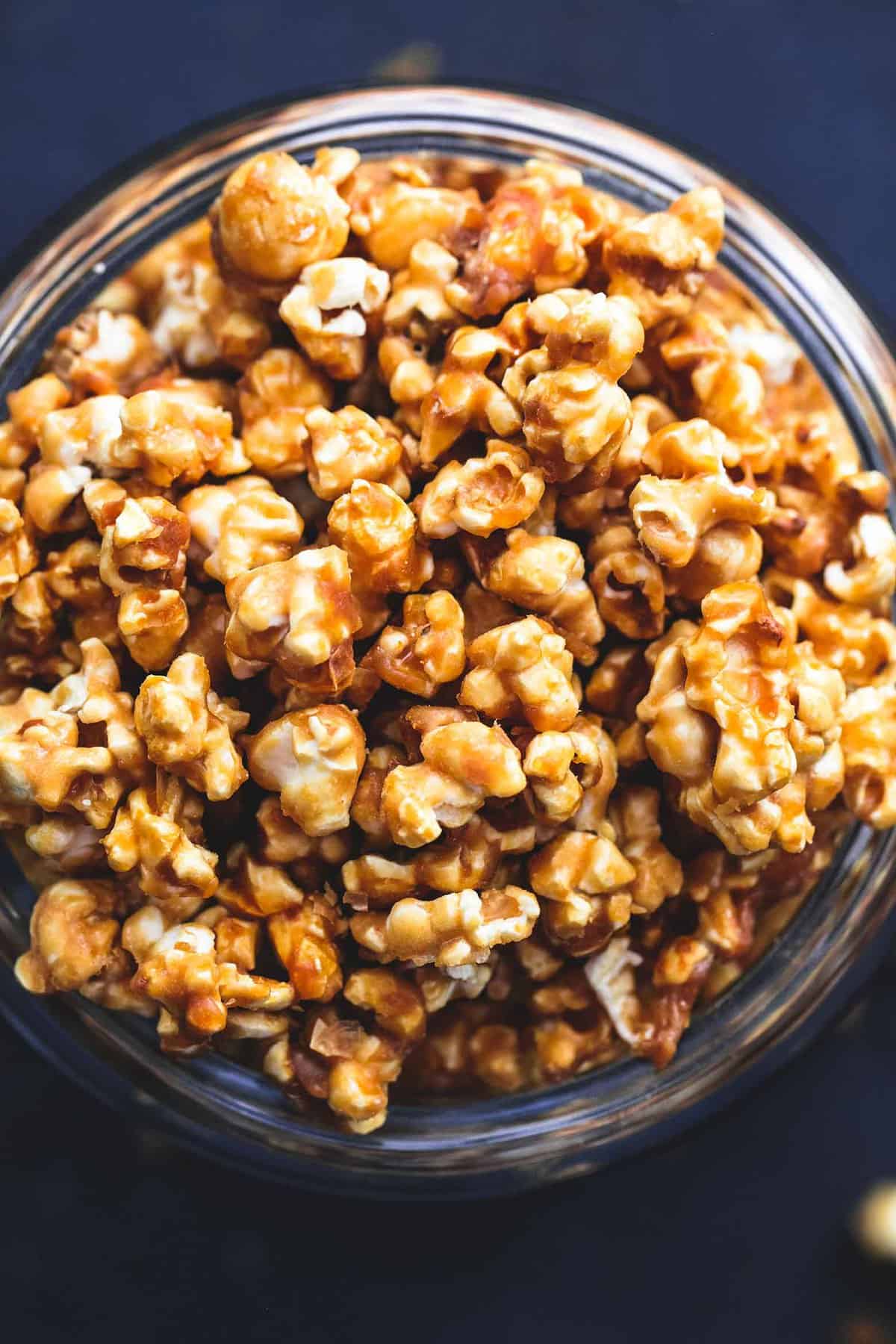 top view of caramel corn in a tall glass jar.