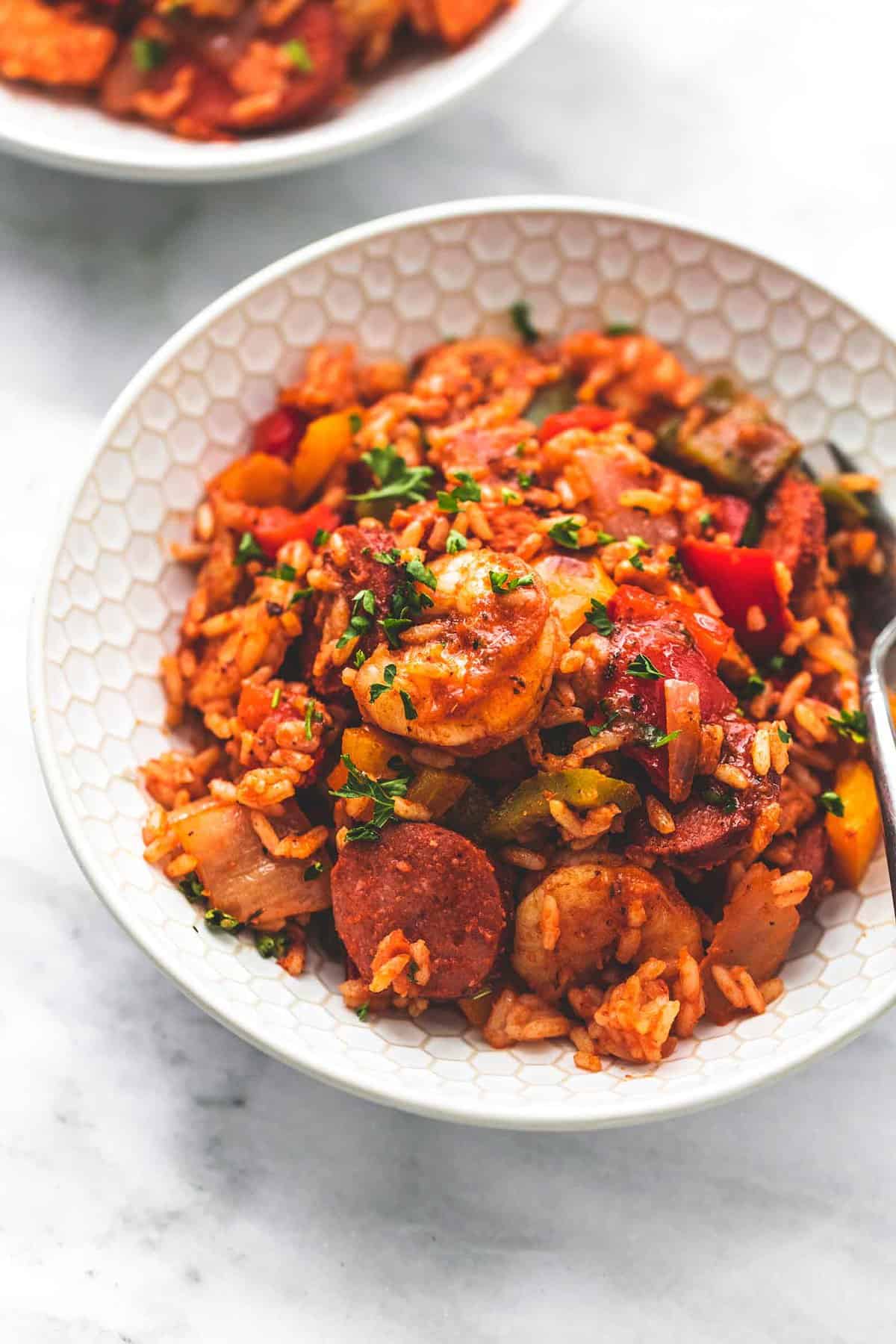 sheet pan jambalaya with a fork in a bowl.