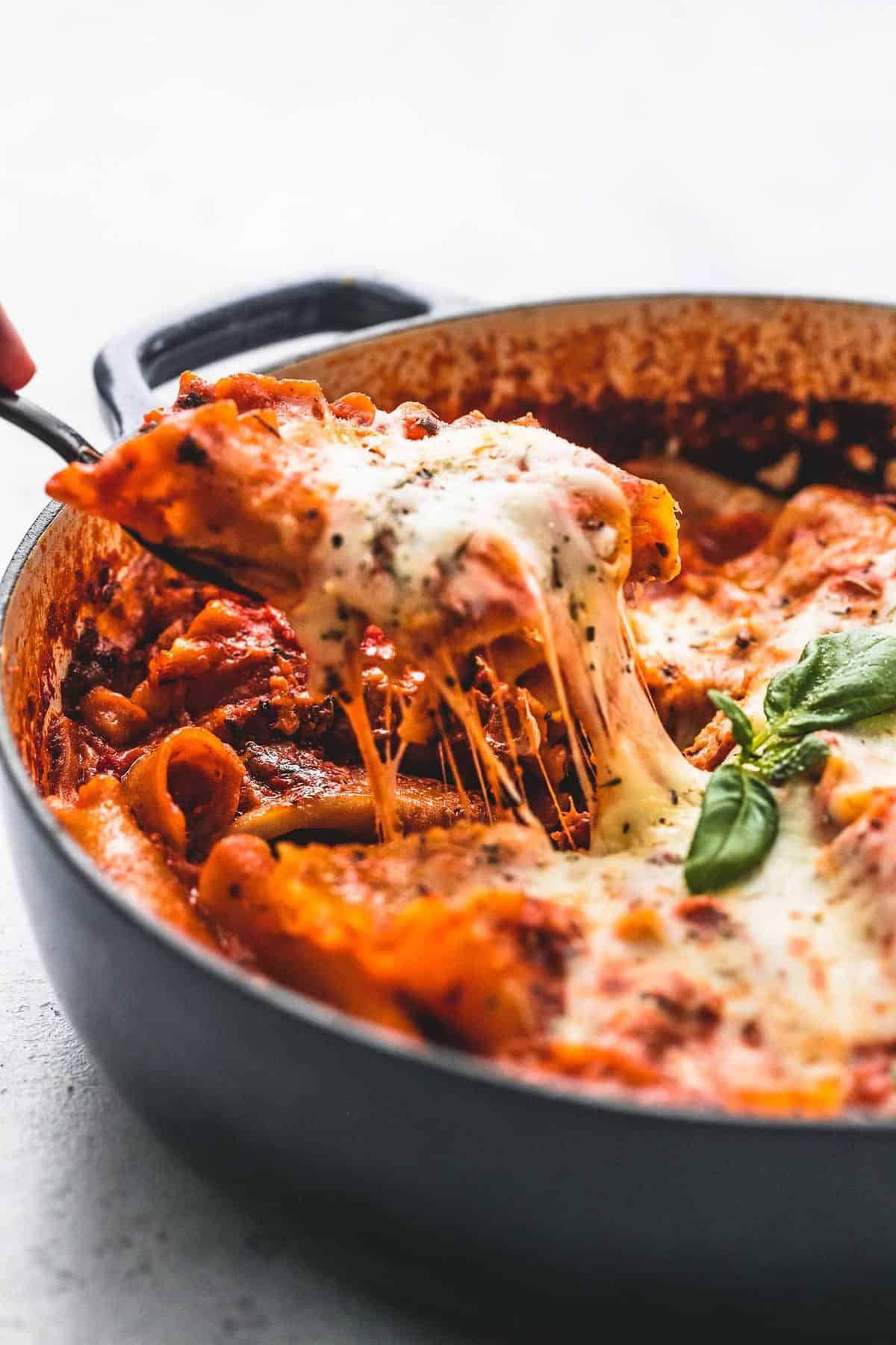 a spatula taking some one pot lasagna from a pot.