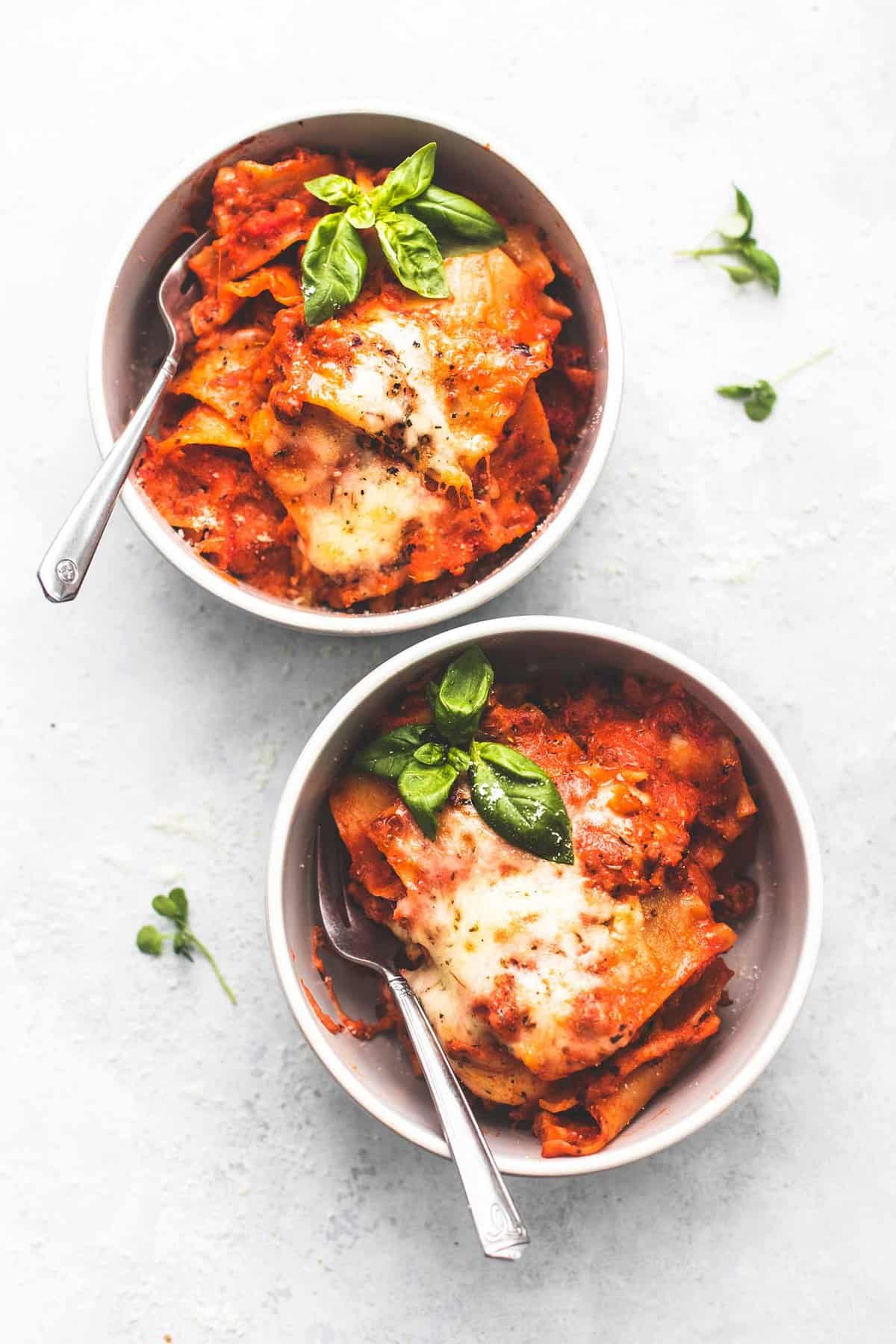 top view of two bowls of one pot lasagna with spoons.