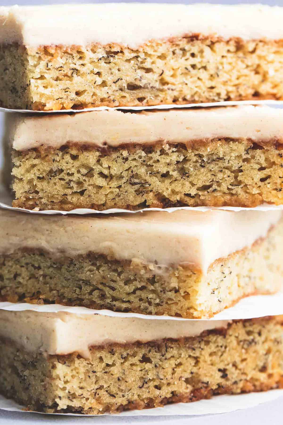 close up of stacked banana bars with cream cheese frosting.