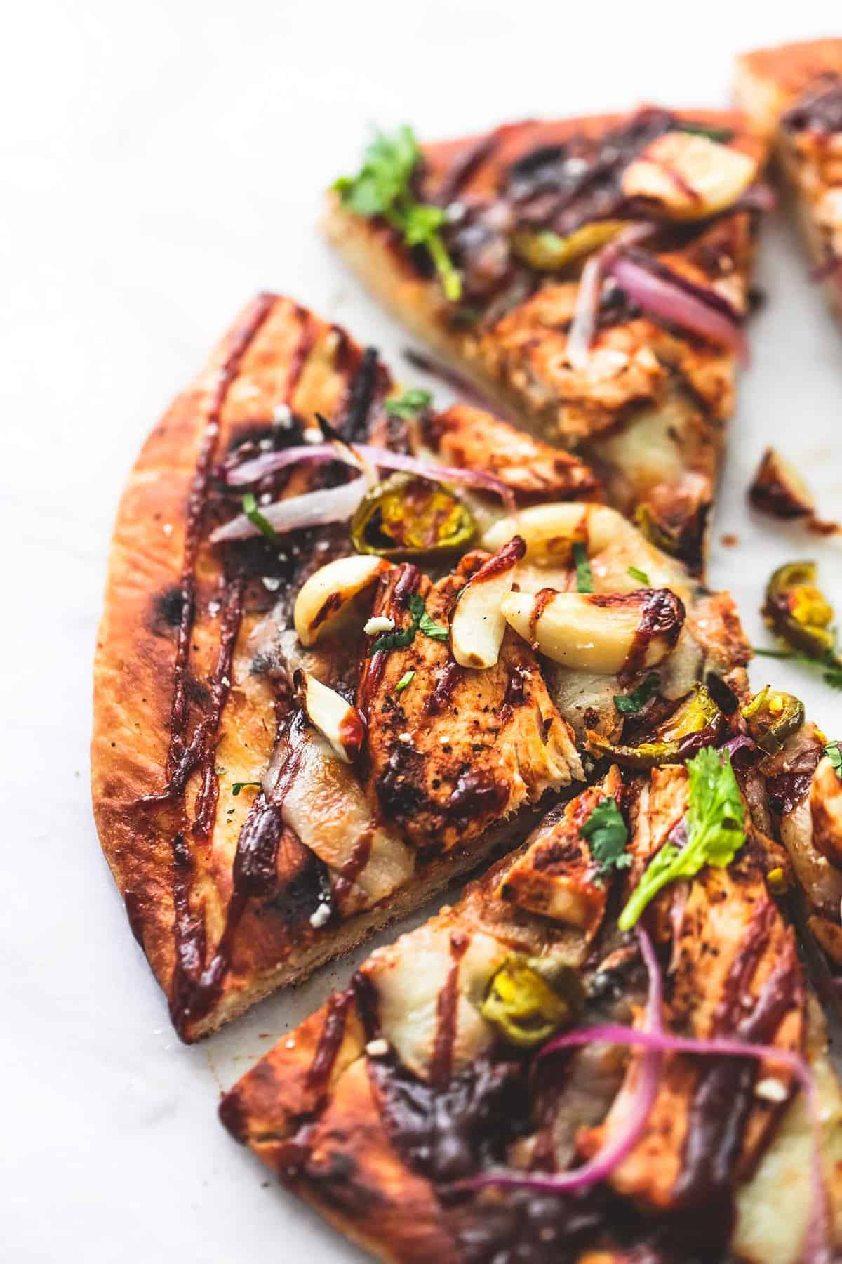 close up of slices of grilled bbq chicken pizza.