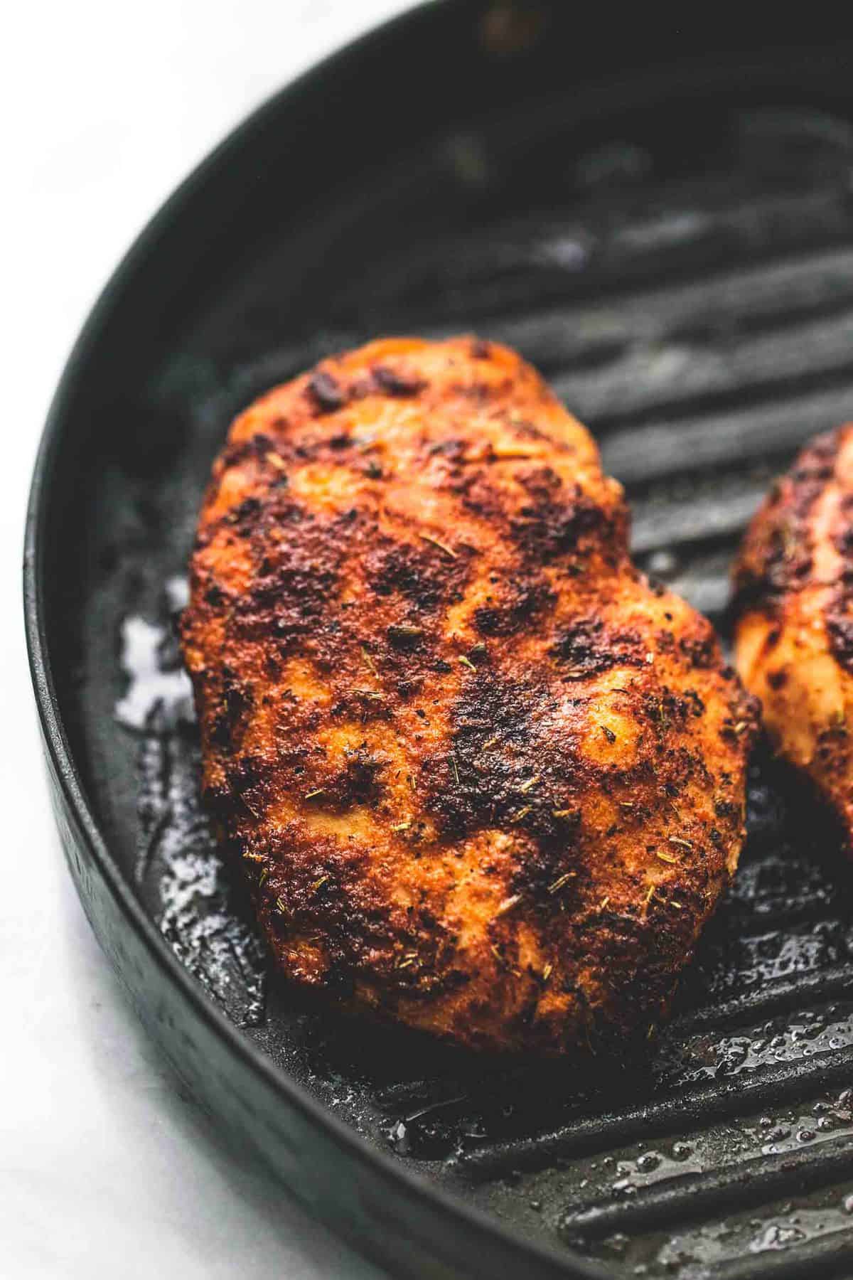 close up of chicken on a grill.