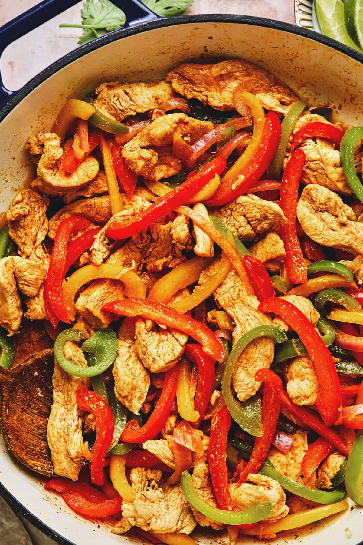 Fillings for chicken fajitas in a skillet.
