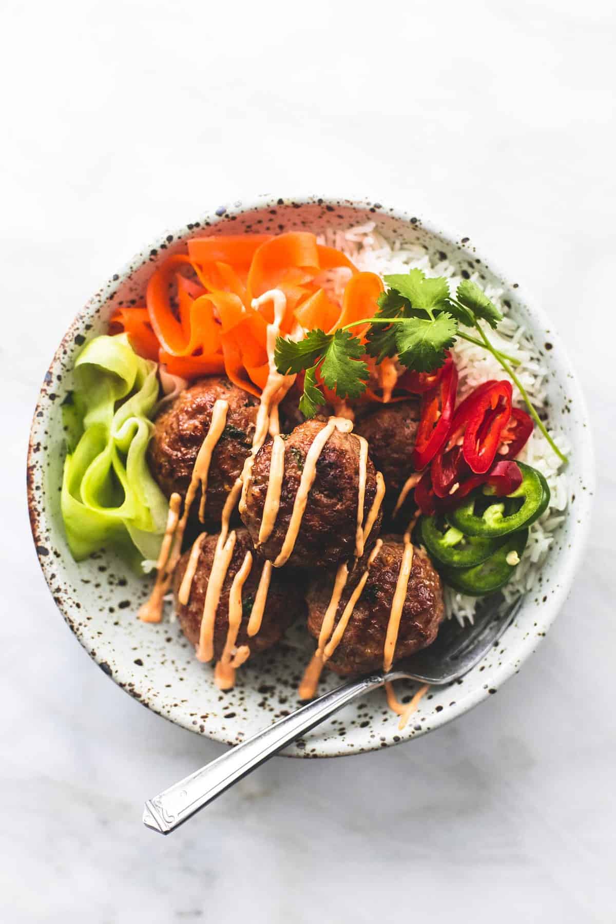 top view of a pork banh mi bowl with a fork.