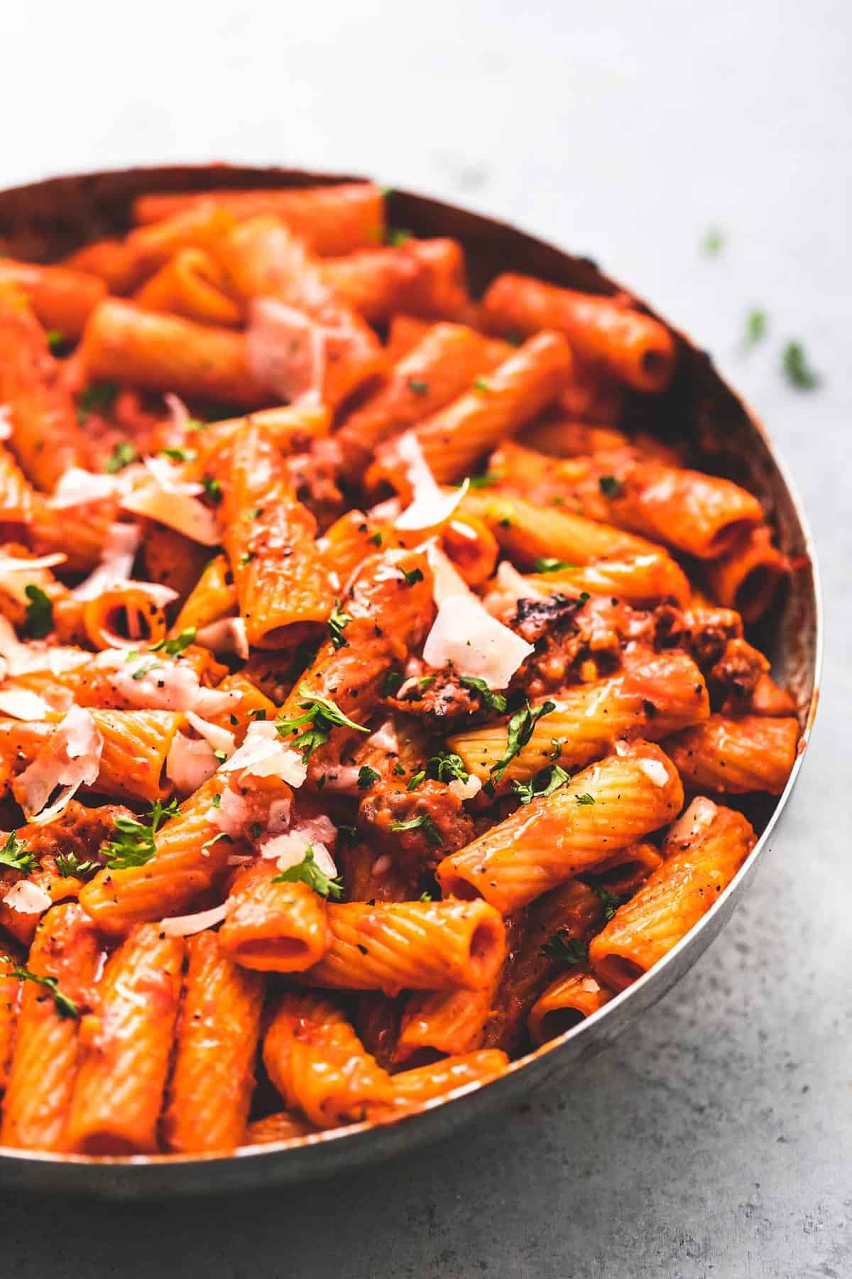 creamy red pepper pasta in a pan.