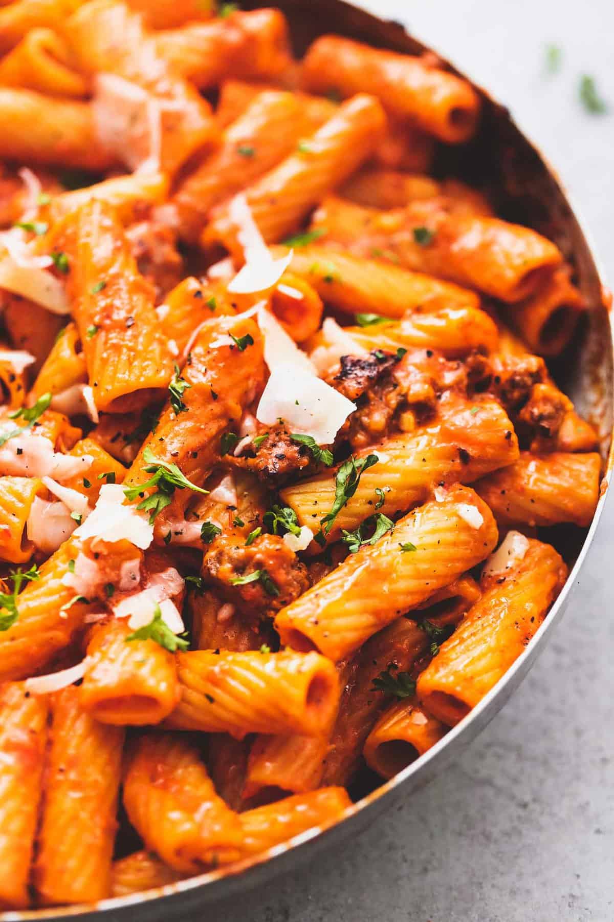 close up of creamy red pepper pasta in a pan.