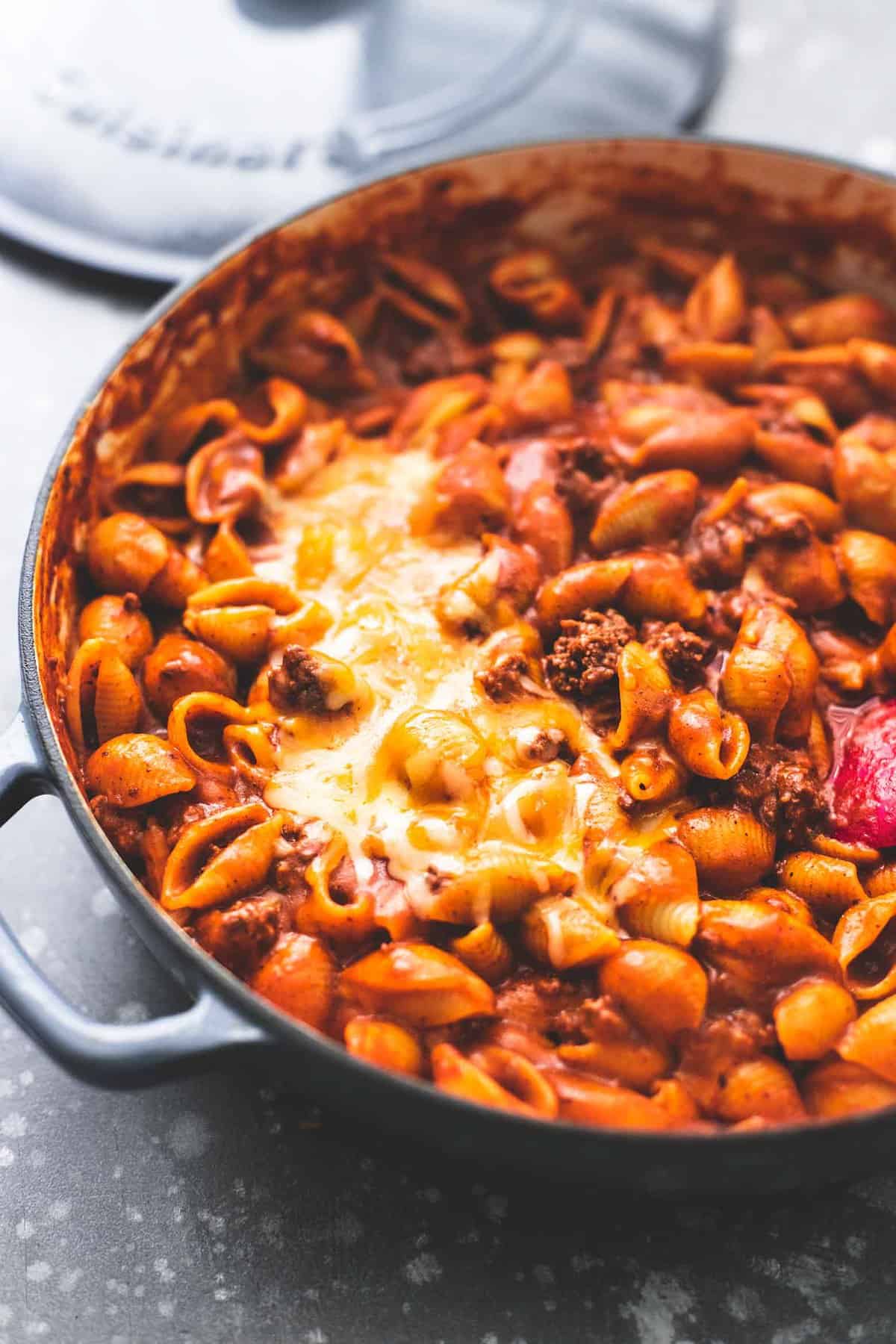 close up of beefy enchilada shells in a pan.