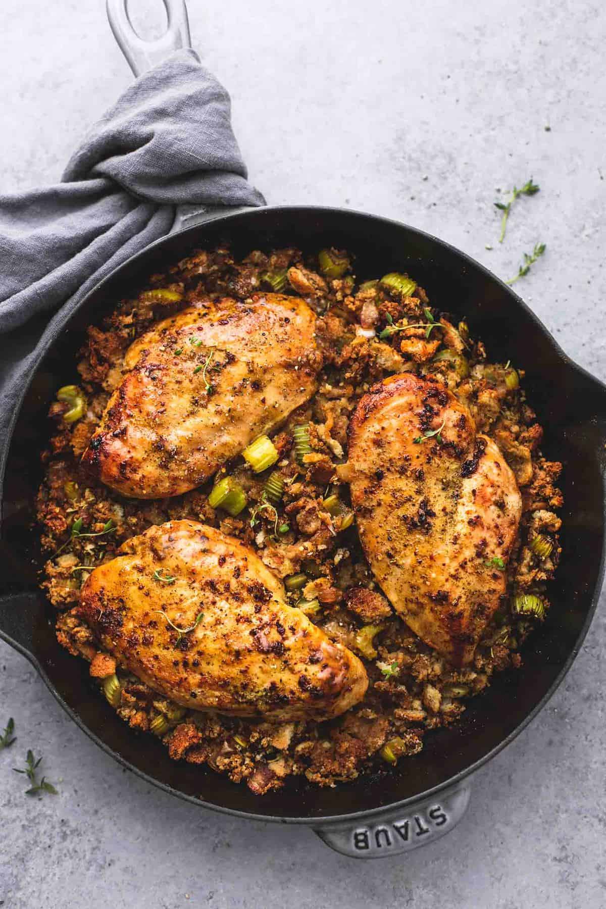 top view of skillet chicken and stuffing in a skillet.