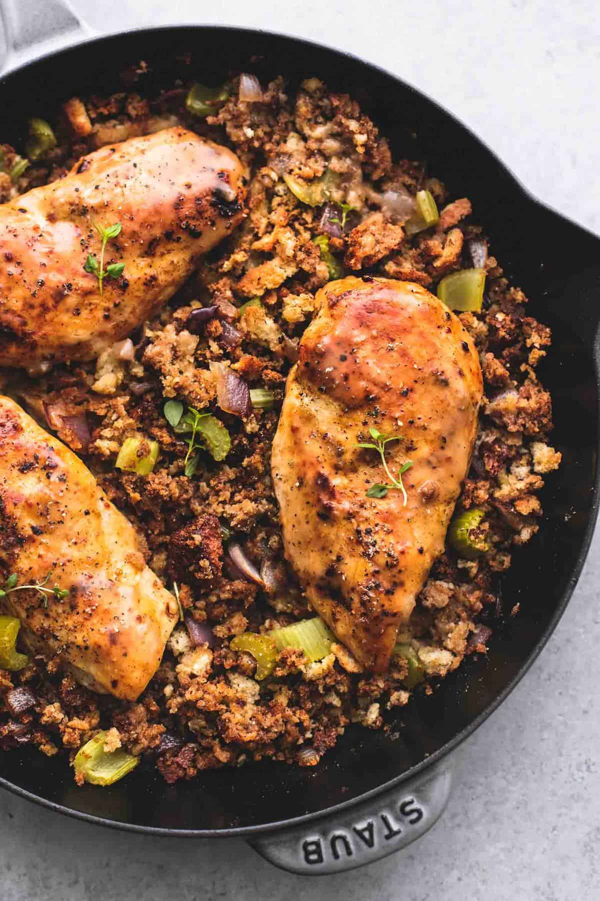 top view of skillet chicken and stuffing in a skillet.