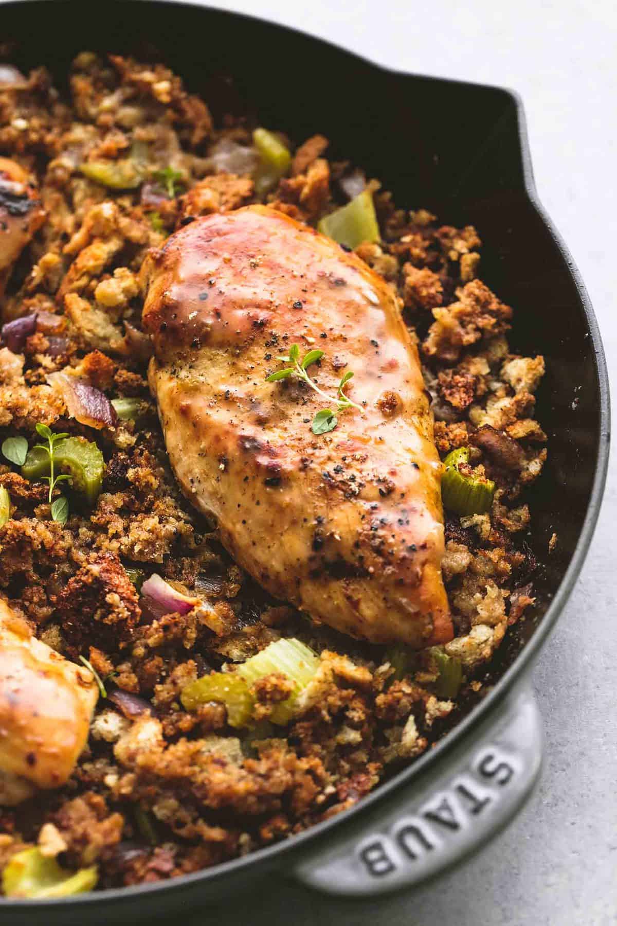 close up of skillet chicken and stuffing in a skillet.