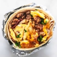 Easy make ahead egg and sausage Freezer Breakfast Burritos Recipe | lecremedelacrumb.com